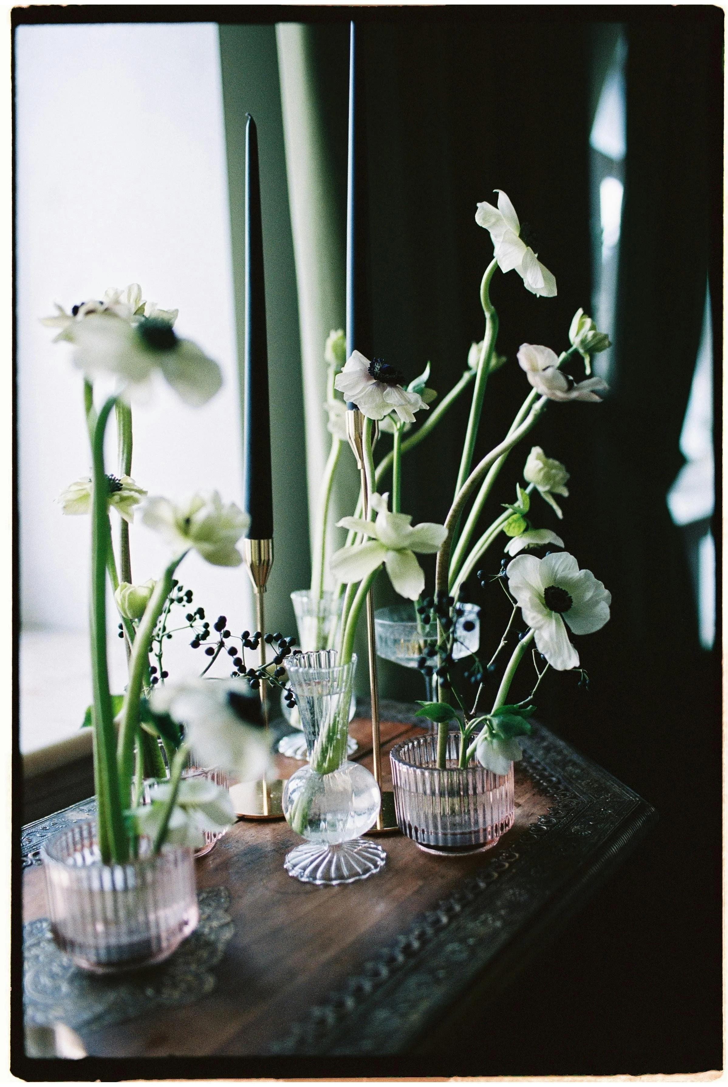 individual flowers in small vases