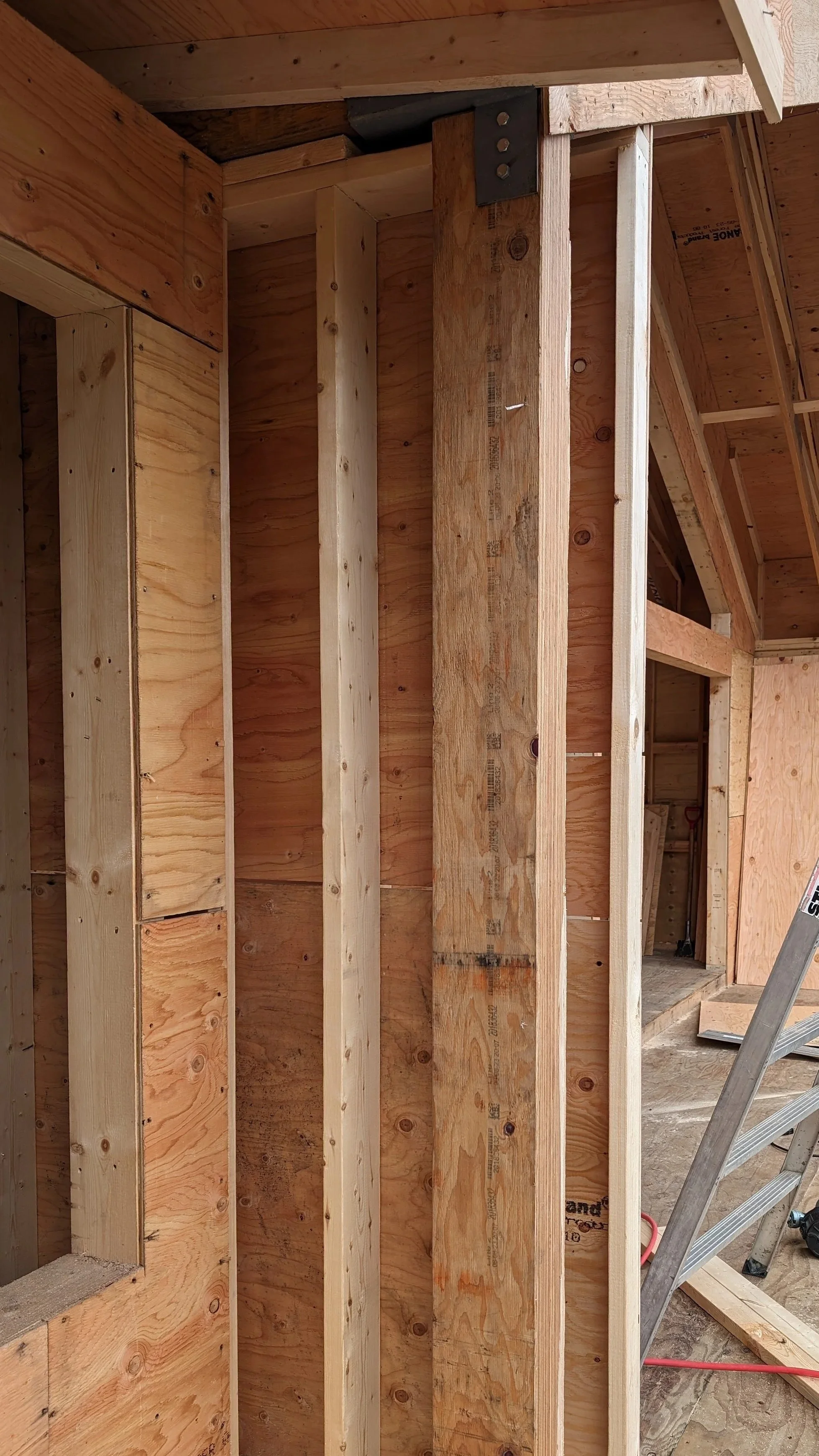 Framing structural post in wall