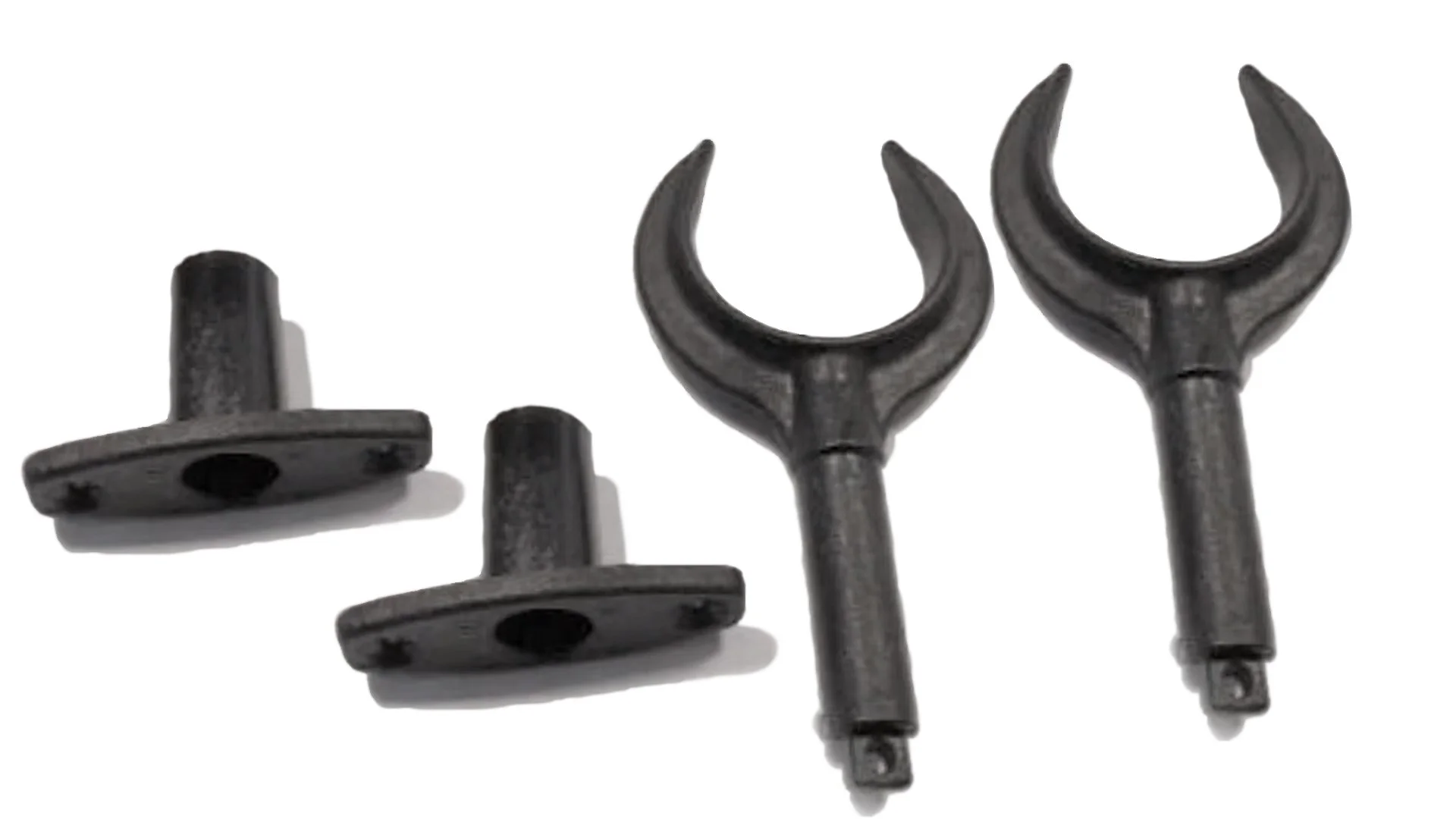 Two wrench tools and two small mechanical parts on a white background.