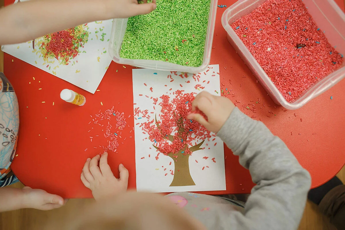 Kids playing with small beads