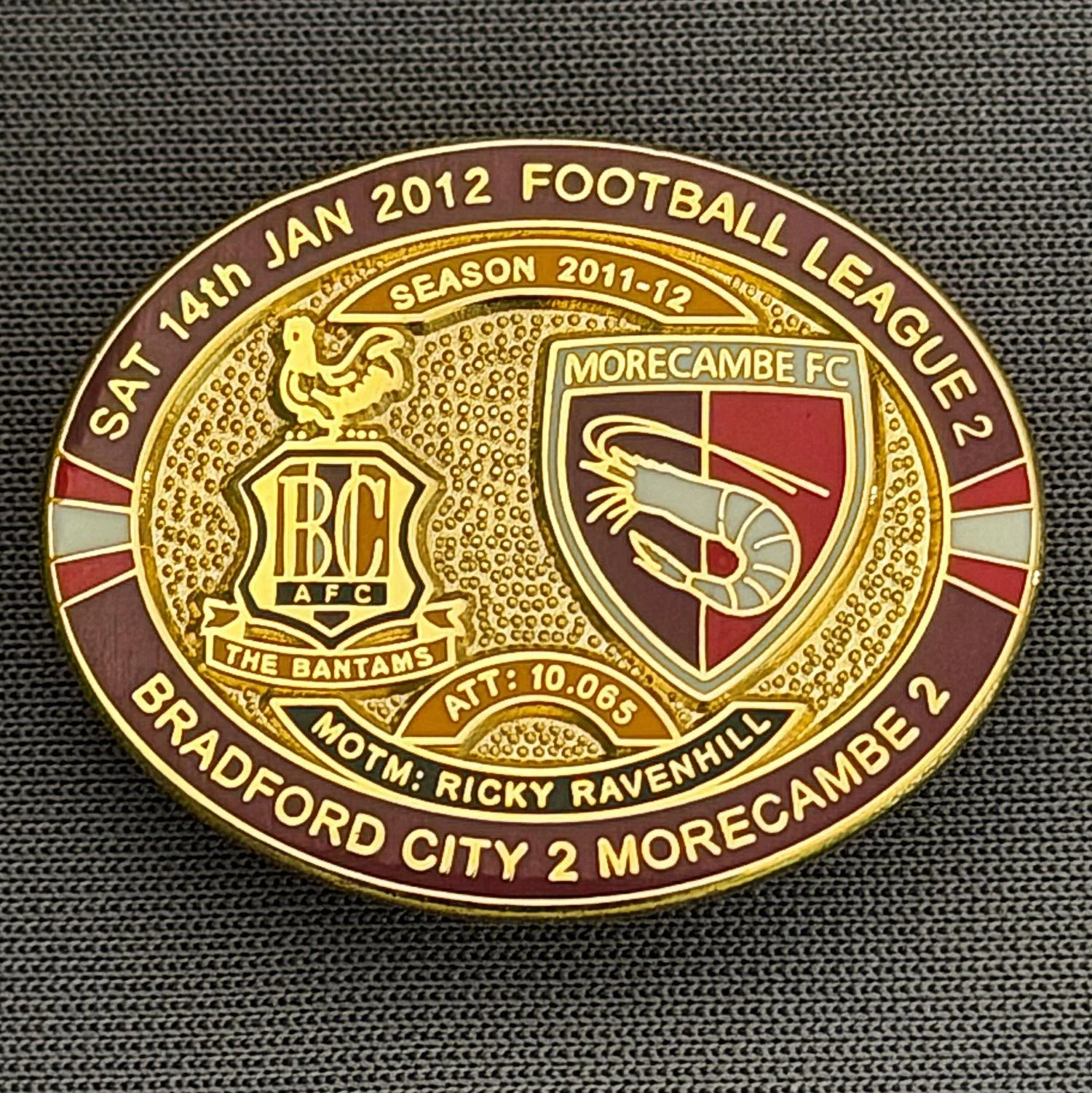 Reference Number: BCFIX082
Size: H 23.6 mm x W 28.7 mm
Pin Type: Brooch Pin
Plating: Gold
Value: £8
Manufacturer: Bradford City Badges
Comments: Bradford City v Morecambe  2011/12 Limited Edition 80 Badges