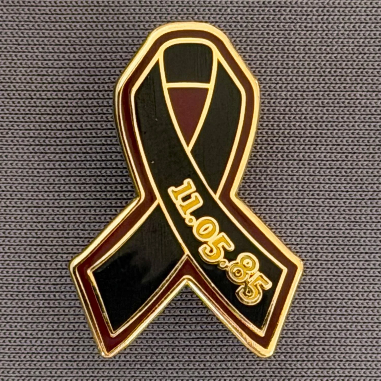 Reference Number: BCFIR015
Size: H 25.7 mm x W 17.8 mm
Pin Type: Metal Clutch
Plating: Gold
Value: £10
Manufacturer: Friends of Bradford City
Comments: Limited Edition of 50, Claret & Black ribbon, to raise money for the PSBRU.