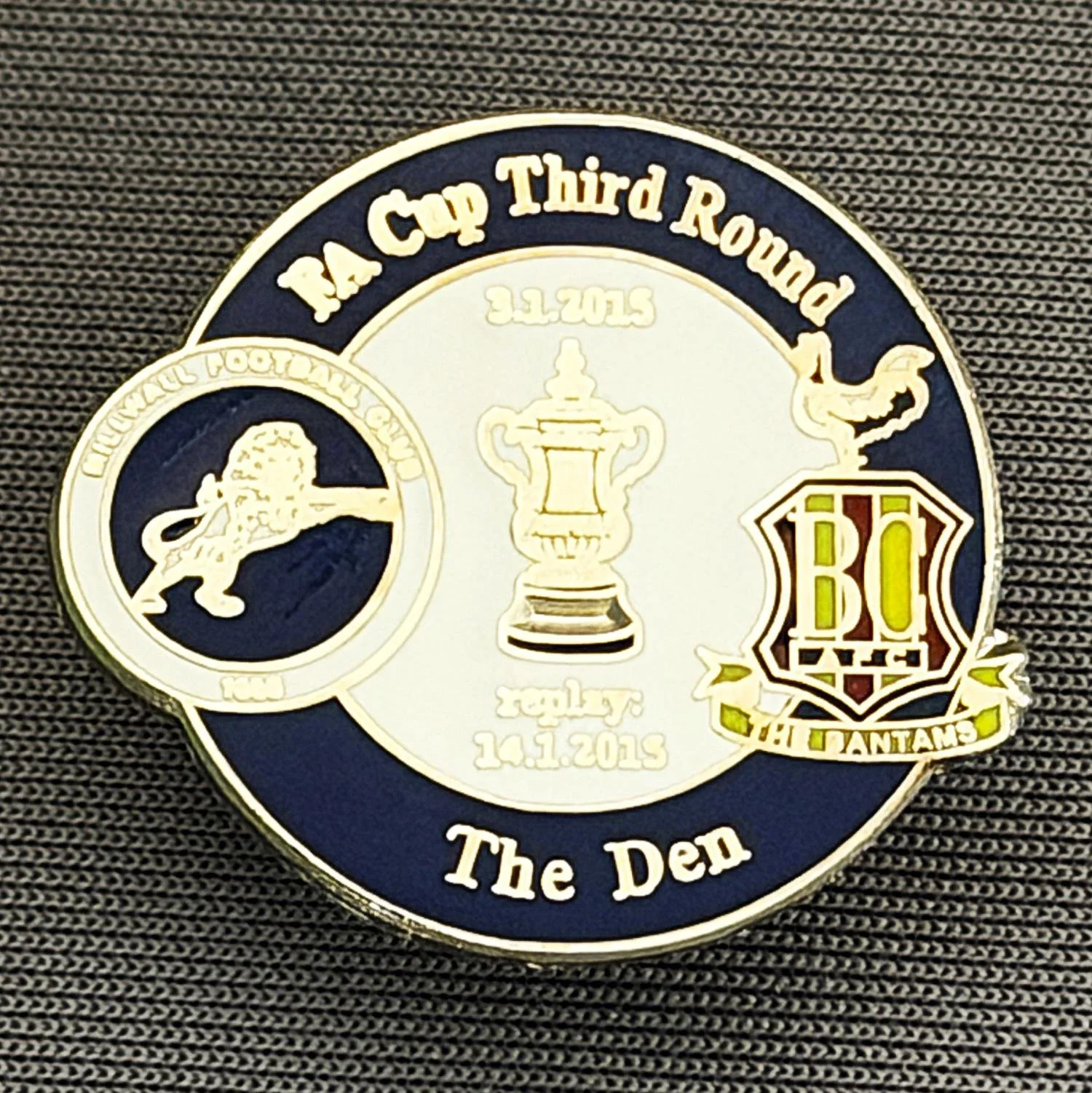 Reference Number: BCFAC082
Size: H 22.7 mm x W 26 mm
Pin Type: Metal Clutch
Plating: Silver
Value: £4
Manufacturer: Dan Lloyd
Comments: F.A. Cup Third Round 2014/15, Away v Millwall, Blue & White Version