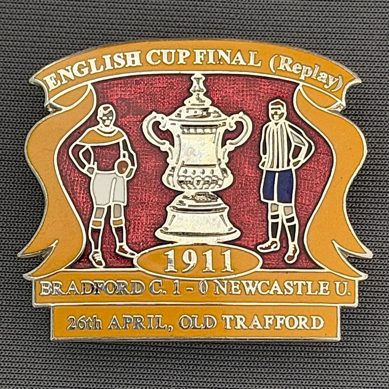 Reference Number: BCFAC001
Size: H 32.5 mm x W 37.6 mm
Pin Type: Double Metal Clutch
Plating: Silver
Value: £15
Manufacturer: Not Known
Comments: 1911 F.A. Cup Final Victory v Newcastle, Claret & Amber Version, Limited Edition of 50
