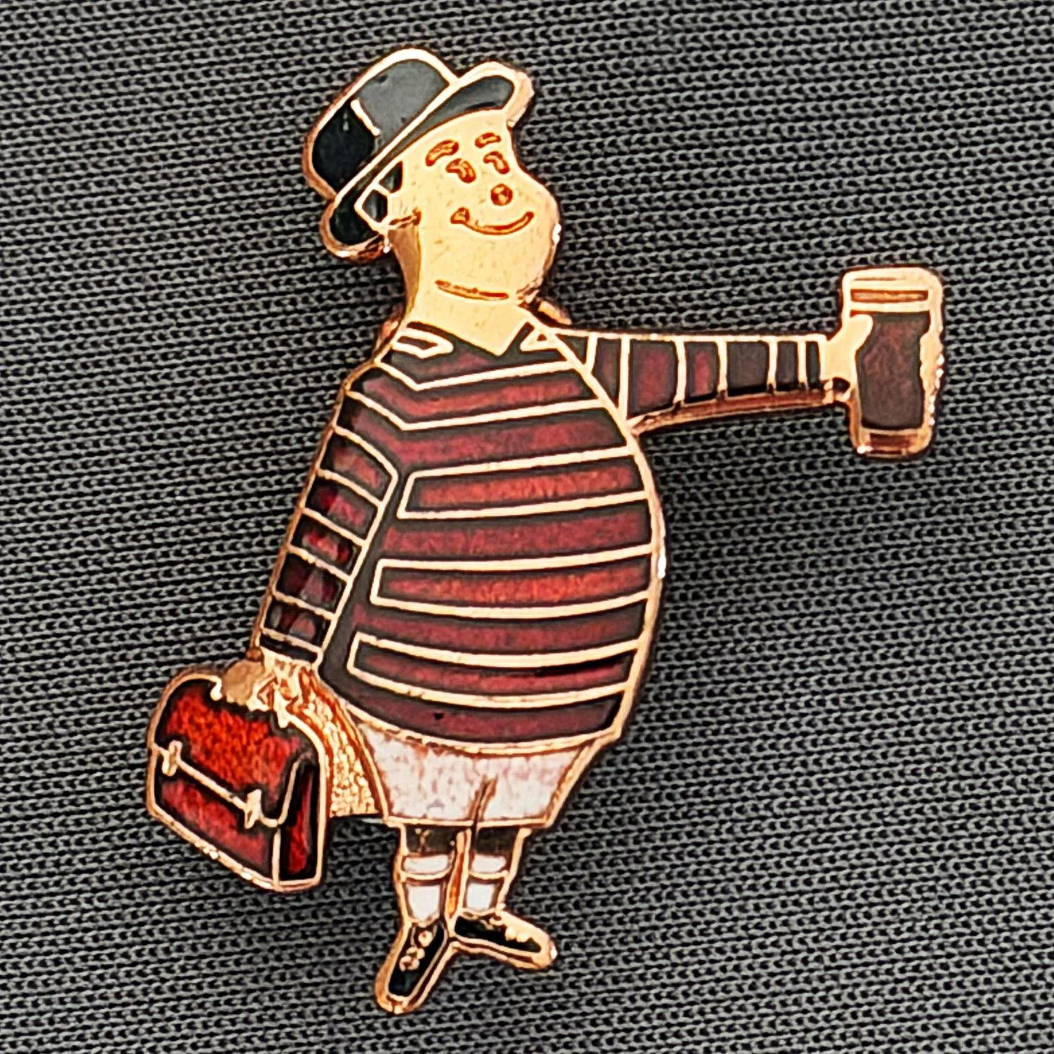Reference Number: BCGEN056
Size: H 28.8 mm x W 20.9 mm
Pin Type: Brooch Pin
Plating: Copper
Value: £15
Manufacturer: Bradford City Badges
Comments: City Gent Beer Cloisonne, Claret Briefcase. Limited Edition Set of 15.