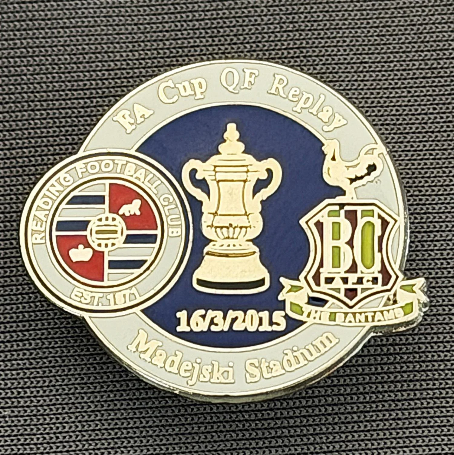Reference Number: BCFAC131
Size: H 21.9 mm x W 26 mm
Pin Type: Metal Clutch
Plating: Silver
Value: £4
Manufacturer: Dan Lloyd
Comments: F.A. Cup Quarter Final Replay 2014/15, Away v Reading, White & Blue Version