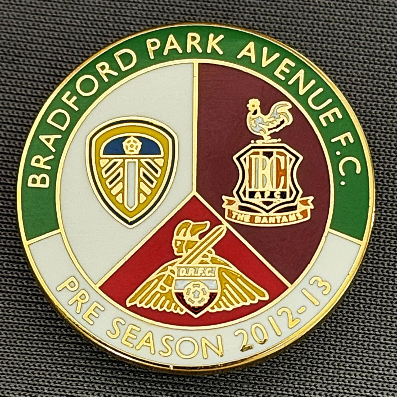 Reference Number: BCOFIX149
Size: D 26 mm
Pin Type: Brooch Pin
Plating: Gold
Value: £5
Manufacturer: Black Dragon
Comments:  Bradford Park Avenue v Bradford City & Others Pre Season Friendly 2012