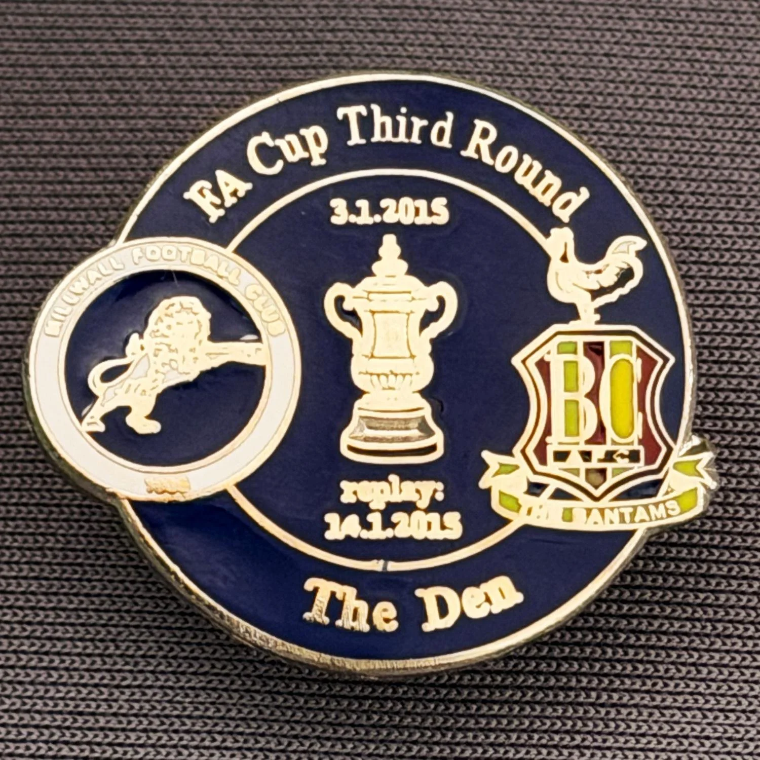 Reference Number: BCFAC079
Size: H 22.7 mm x W 26 mm
Pin Type: Metal Clutch
Plating: Silver
Value: £4
Manufacturer: Dan Lloyd
Comments: F.A. Cup Third Round 2014/15, Away v Millwall, Blue Version