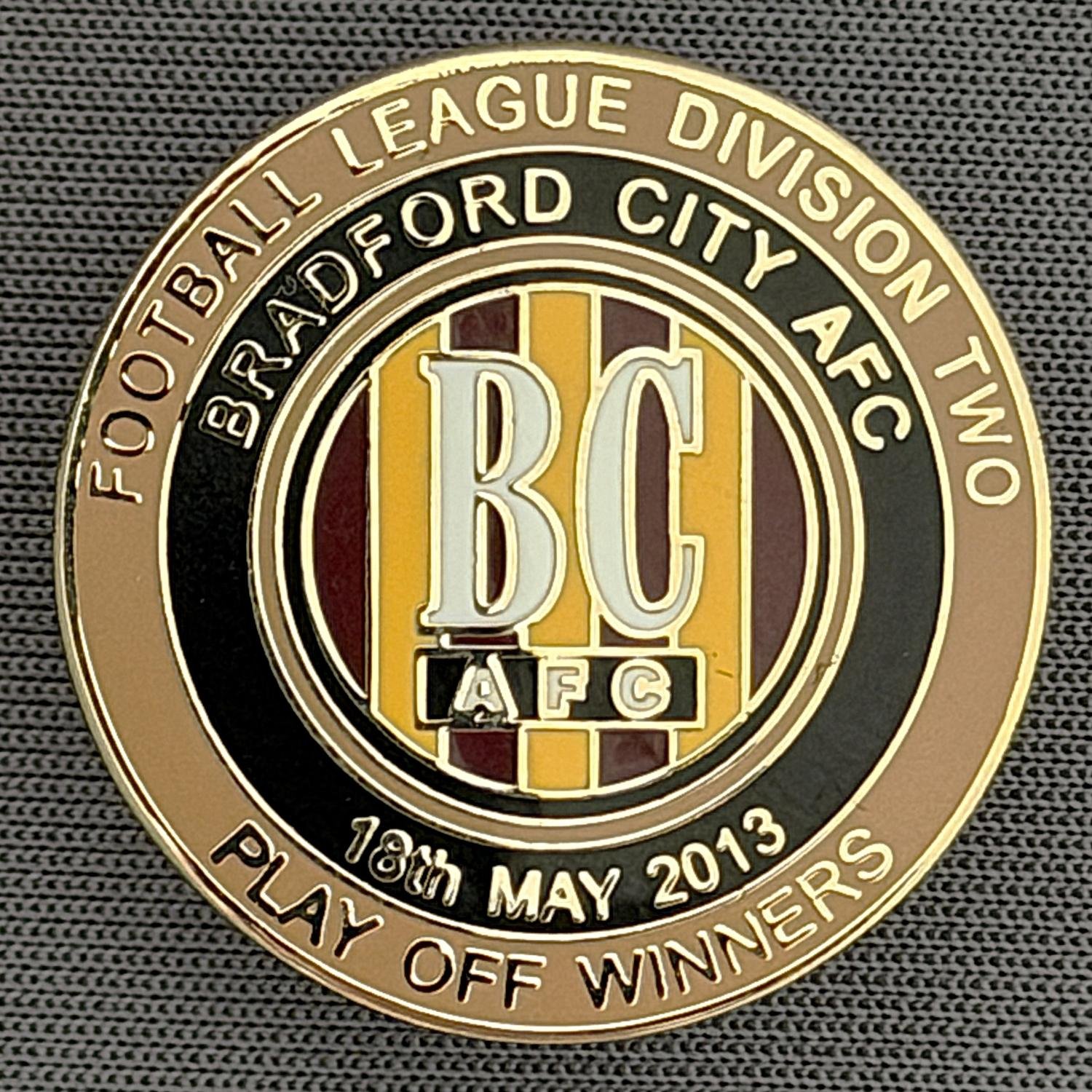 Reference Number: BCEVE071
Size: D 24.2 mm
Pin Type: Metal Clutch
Plating: Gold
Value: £8
Manufacturer: Dave Horn
Comments: 2013 Div 2 Play Off Winners, 
Gold & Black. Boxed Set Limited Edition of 25
