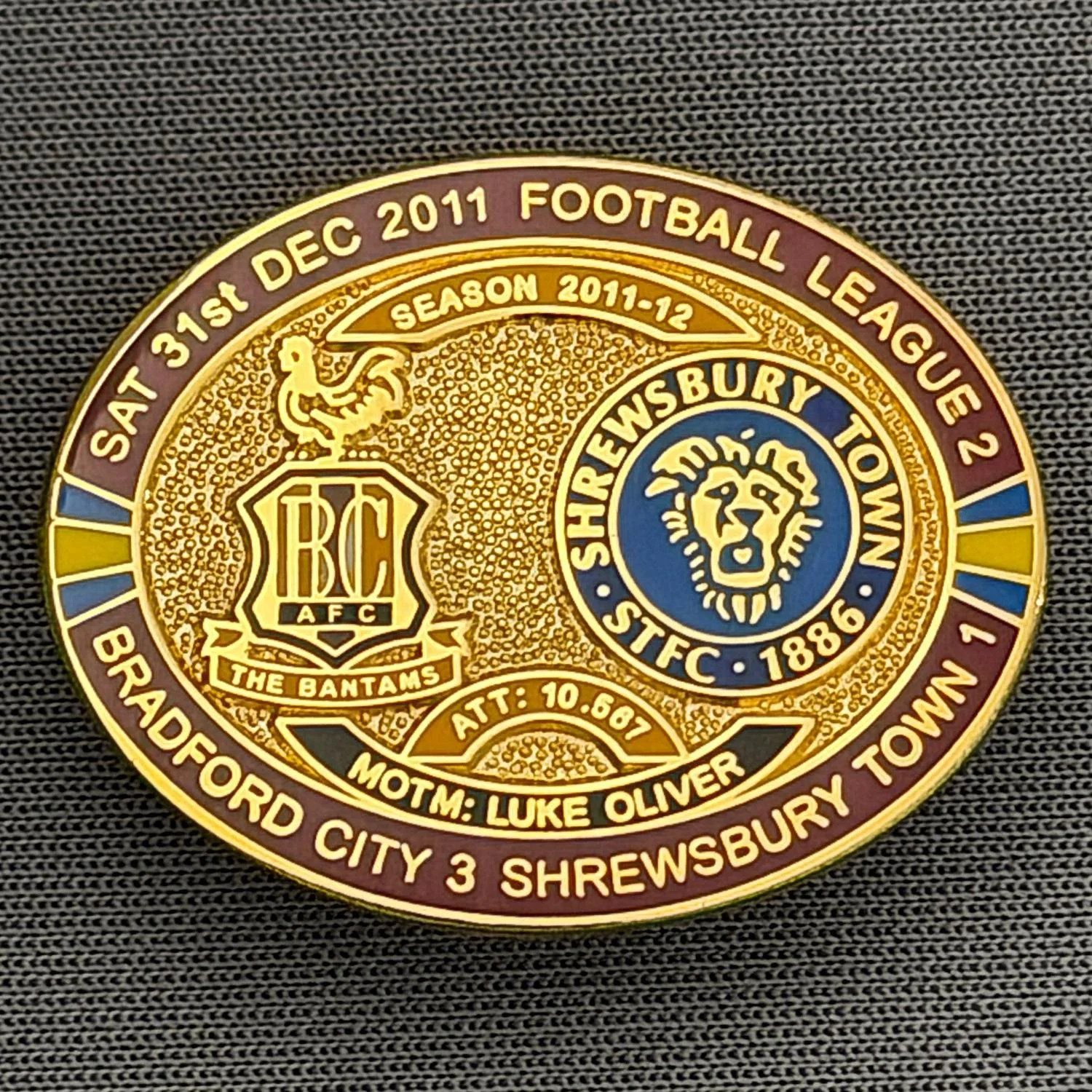 Reference Number: BCFIX081
Size: H 23.6 mm x W 28.7 mm
Pin Type: Brooch Pin
Plating: Gold
Value: £8
Manufacturer: Bradford City Badges
Comments: Bradford City v Shrewsbury Town  2011/12 Limited Edition 80 Badges
