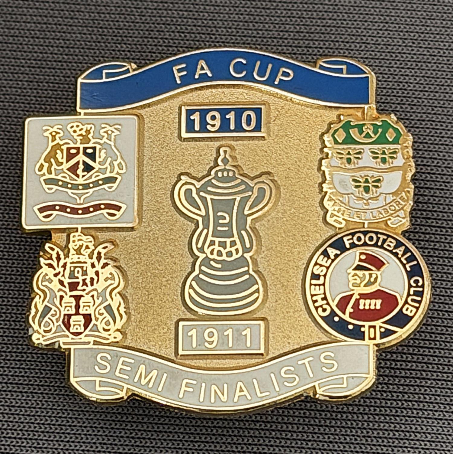 Reference Number: BCFAC033
Size: H 29.1 mm x W 31.3 mm
Pin Type: Brooch Pin
Plating: Gold
Value: £6
Manufacturer: Unknown
Comments: 1910-1911, F.A. Cup Semi Finalists Mid Blue & White Version