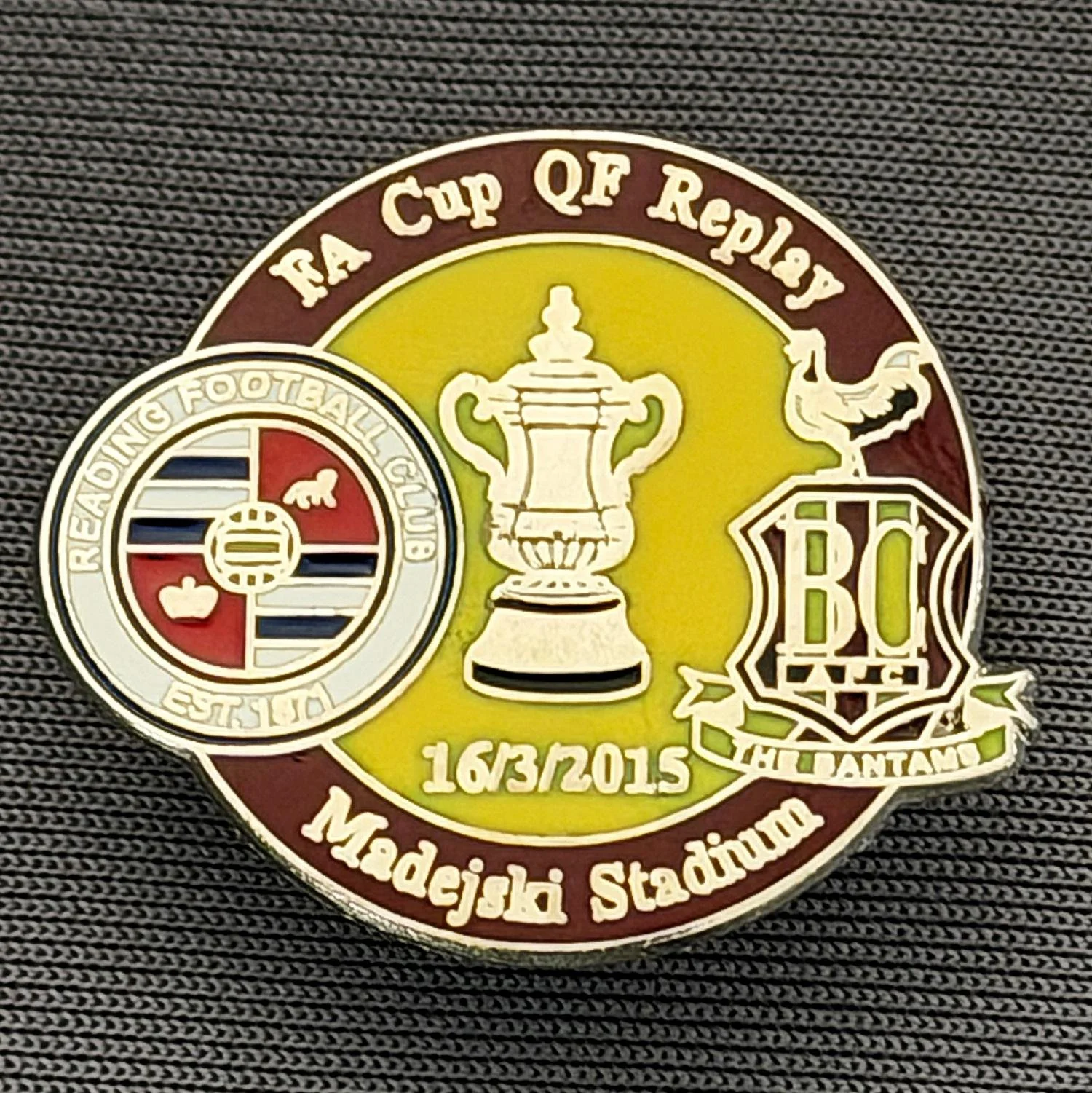 Reference Number: BCFAC122
Size: H 21.9 mm x W 26 mm
Pin Type: Metal Clutch
Plating: Silver
Value: £4
Manufacturer: Dan Lloyd
Comments: F.A. Cup Quarter Final Replay 2014/15, Away v Reading, Claret & Amber Version