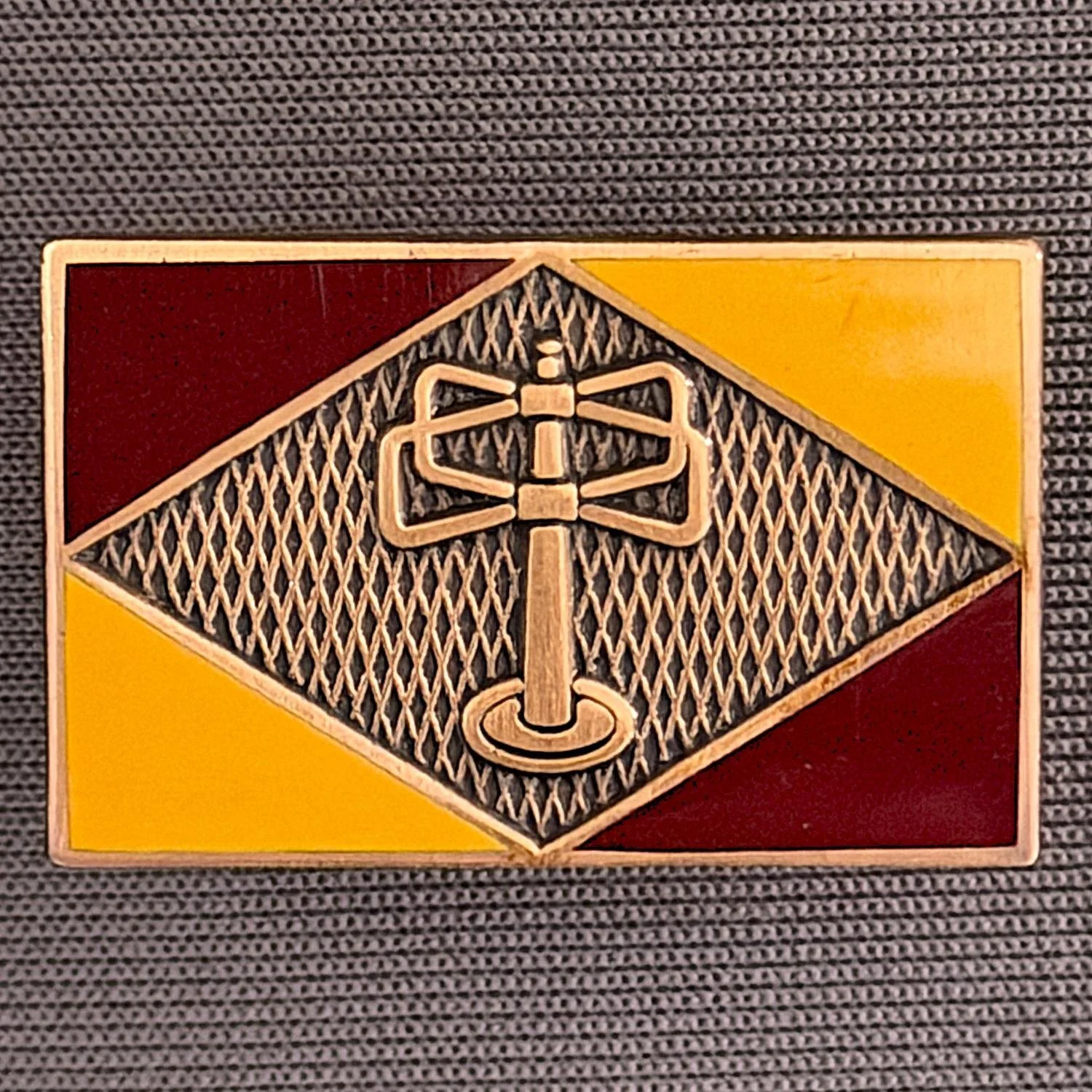 Reference Number: BCUN058
Size: H 20.5 mm x W 32 mm
Pin Type: Brooch Pin
Plating: Antique Gold
Value: £10
Manufacturer: Bradford City Badges
Comments: Claret & Amber Turnstylewear Badge, Limited Edition of 1
