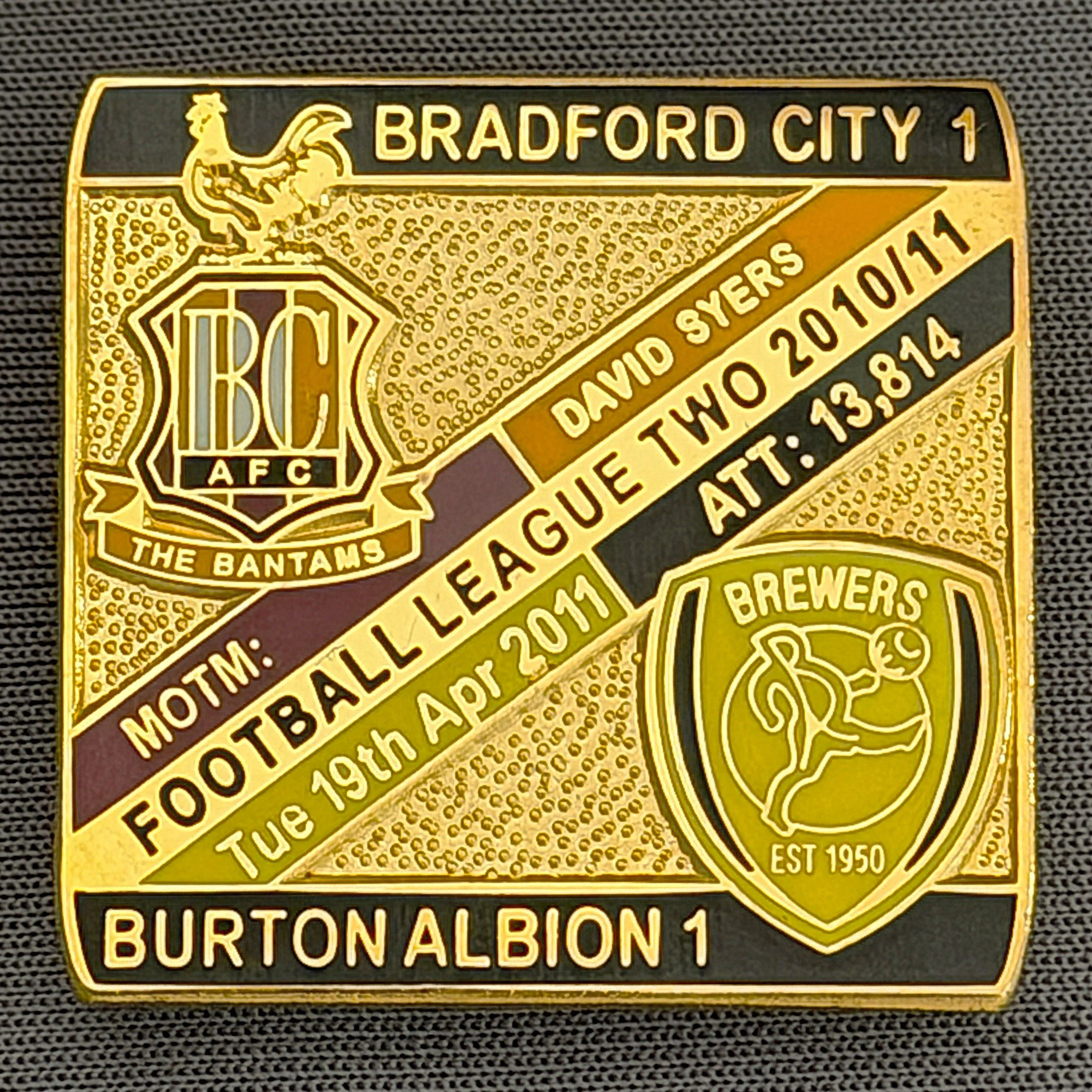 Reference Number: BCFIX067
Size: H 28.3 mm x W 29.3 mm
Pin Type: Brooch Pin
Plating: Gold
Value: £8
Manufacturer: Bradford City Badges
Comments: Bradford City v Burton Albion 2010/11 Limited Edition 100 Badges