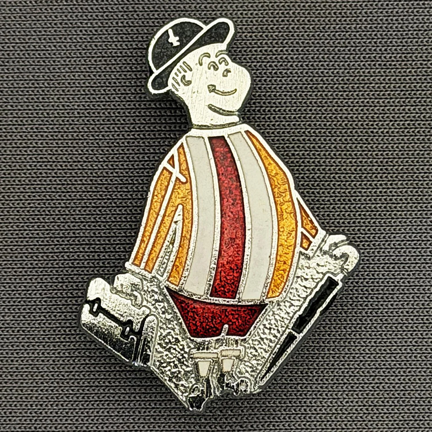Reference Number: BCGEN006
Size: H 31.2 mm x W 21.1 mm
Pin Type: Brooch Pin
Plating: Silver
Value: £15
Manufacturer: Rojack Stamping
Comments: Classic City Gent Badge, Alternate Shirt, Claret Shorts. Mid 1980s.
