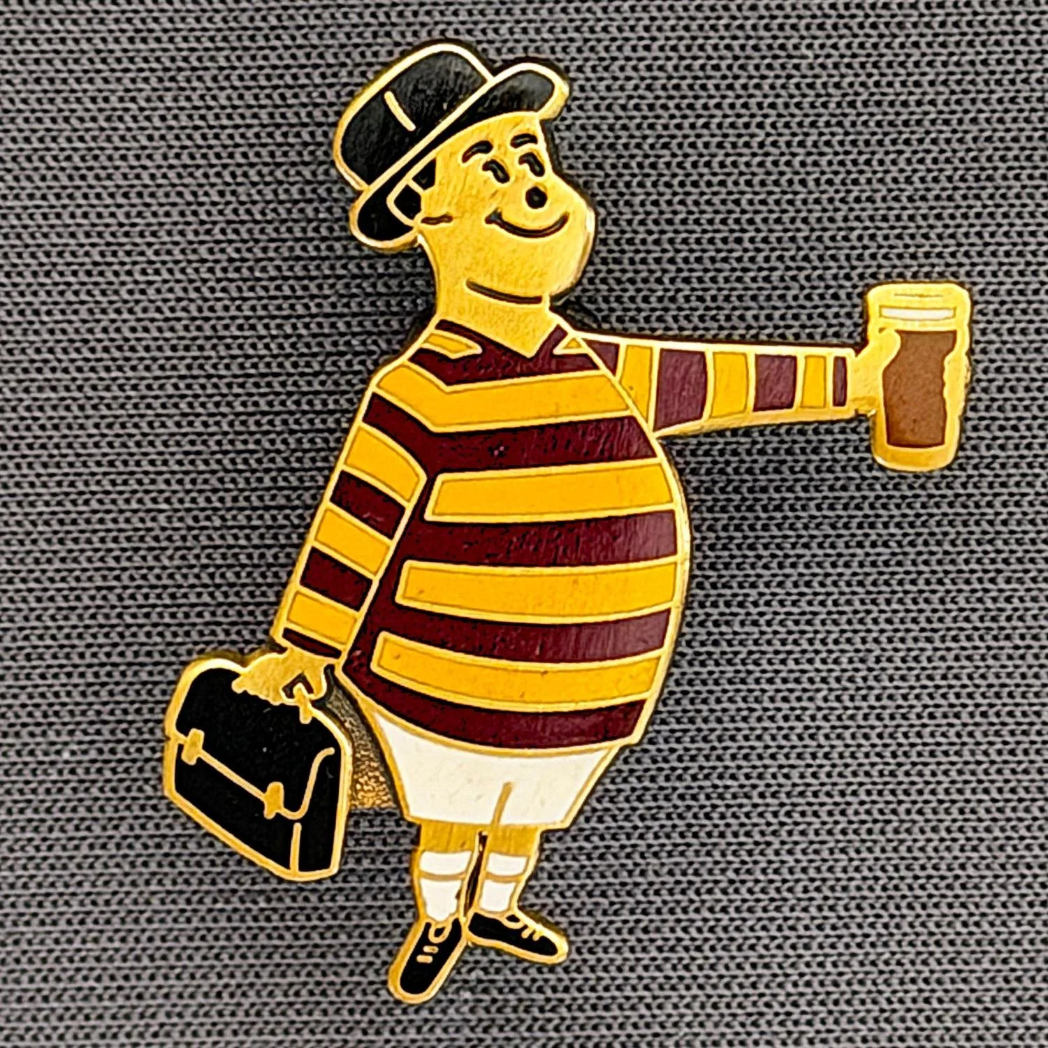 Reference Number: BCGEN076
Size: H 28.8 mm x W 20.9 mm
Pin Type: Brooch Pin
Plating: Antique Bronze
Value: £20
Manufacturer: Bradford City Badges
Comments: City Gent Beer, Black Briefcase. One Off Badge.