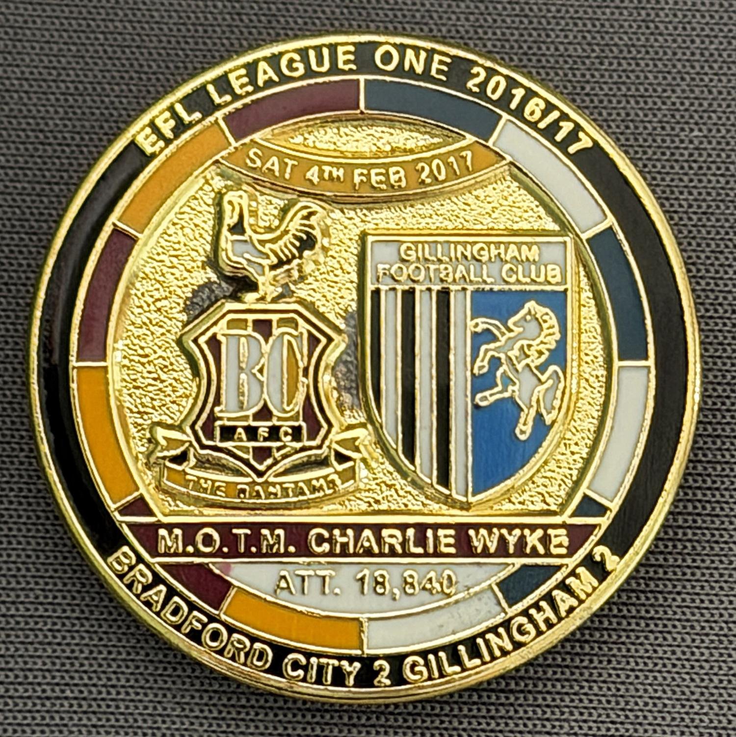 Reference Number: BCFIX384
Size: D 29.4 mm
Pin Type: Brooch Pin
Plating: Gold
Value: £8
Manufacturer: Bradford City Badges
Comments: Bradford City v Gillingham 2015/16, Limited Edition of 50 Badges (Gold Version)
