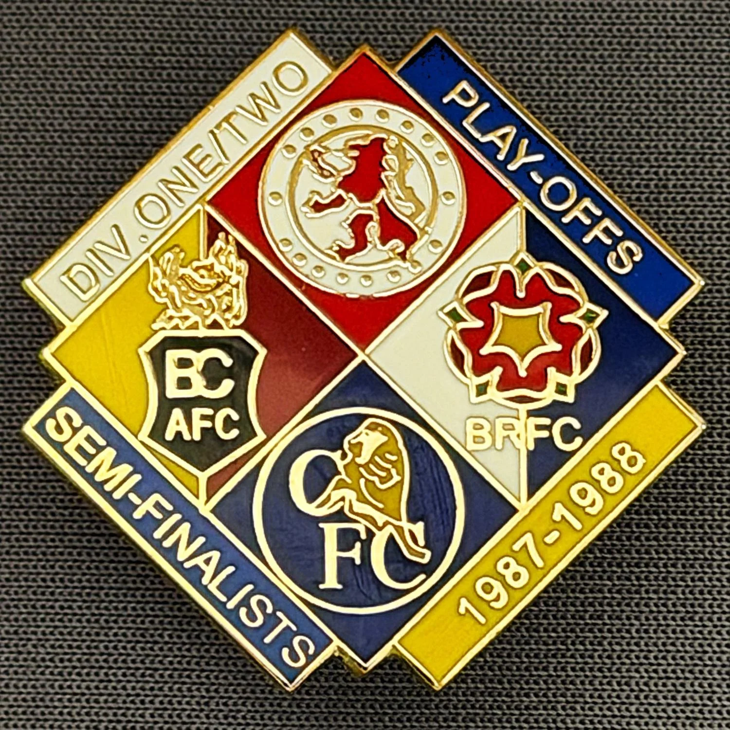 Reference Number: BCOFIX049
Size: H 29.8 mm x W 30 mm
Pin Type: Double Metal Clutch
Plating: Gold
Value: £8
Manufacturer: Unknown
Comments: 1987-1988 Play Off Semi Finalists Blue, Amber & White, Version, Limited Edition 50