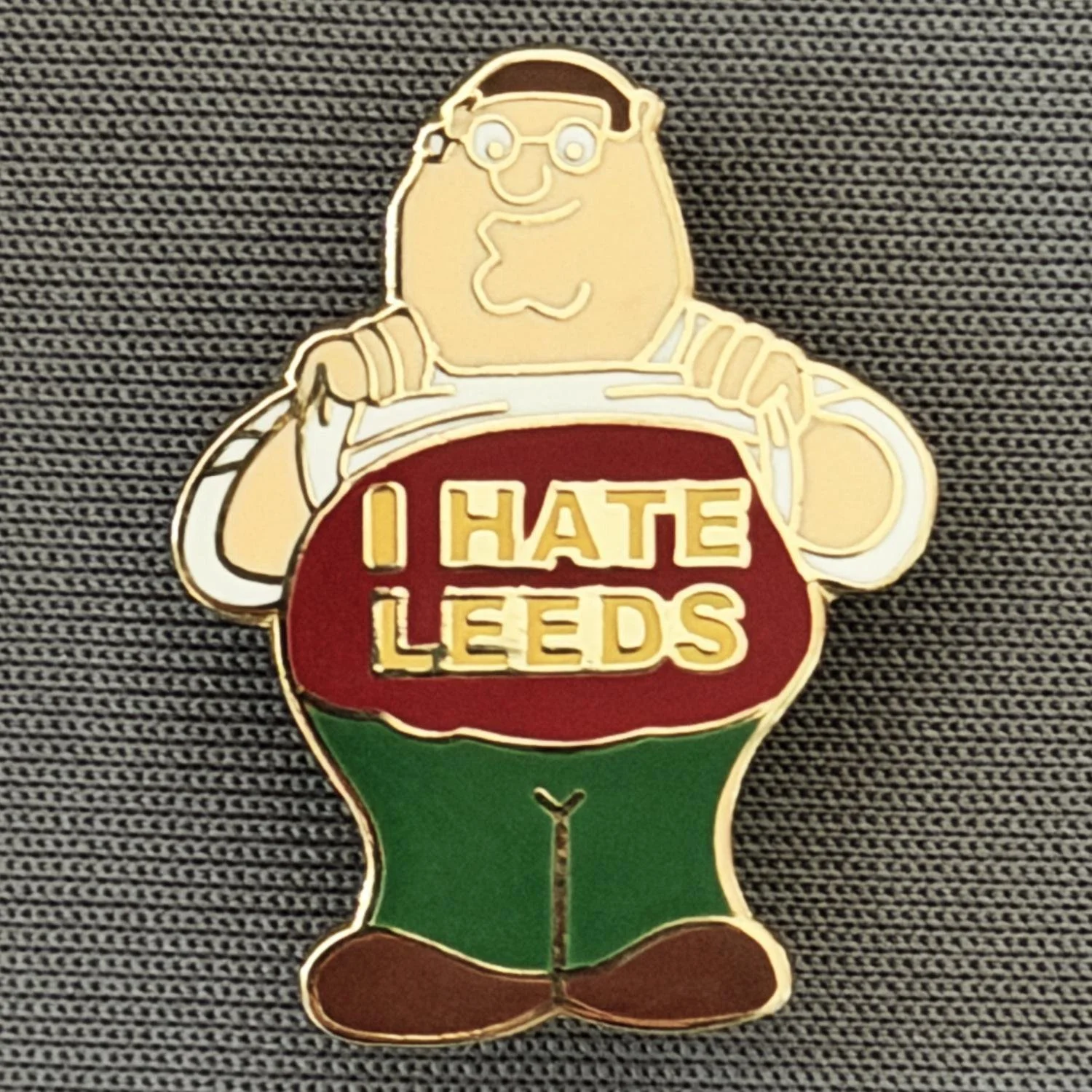 Reference Number: BCCTN037
Size: H 24.4 mm x W 18.6 mm
Pin Type: Brooch Pin
Plating: Gold
Value: £6
Manufacturer: Not Known
Comments: Pete Griffin Family Guy, I Hate Leeds, Claret & Amber