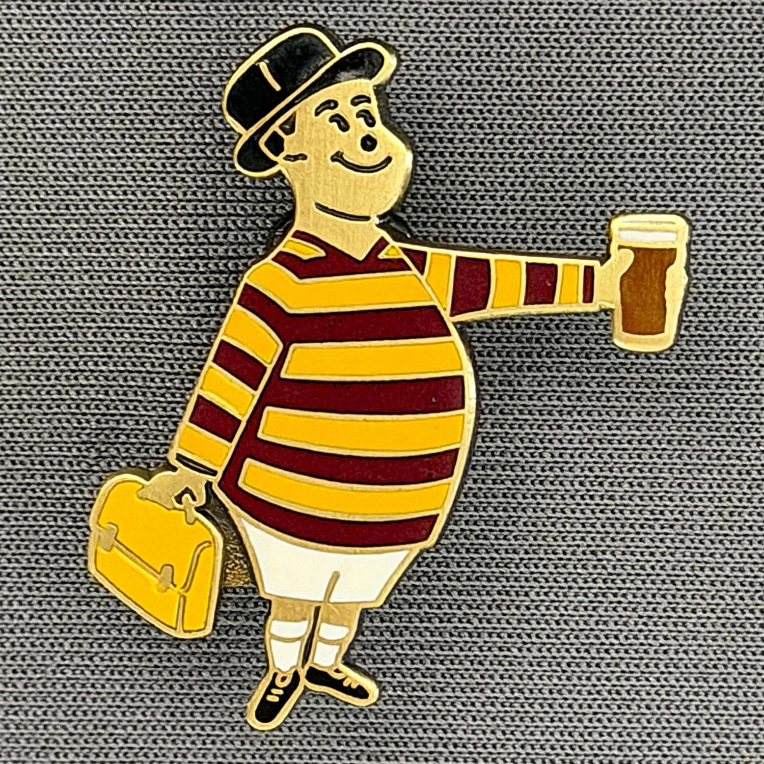 Reference Number: BCGEN100
Size: H 28.8 mm x W 20.9 mm
Pin Type: Brooch Pin
Plating: Antique Gold
Value: £20
Manufacturer: Bradford City Badges
Comments: City Gent Beer, Amber Briefcase. One Off Badge.
