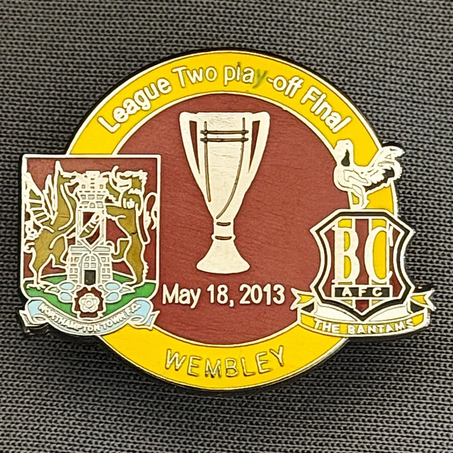 Reference Number: BCOFIX028
Size: H 23.7 mm x W 28.4 mm
Pin Type: Metal Clutch
Plating: Antique Silver
Value: £4
Manufacturer: Dan Lloyd
Comments: League 2 Play Off Final City v Northampton Town 2013, Amber & Claret Version