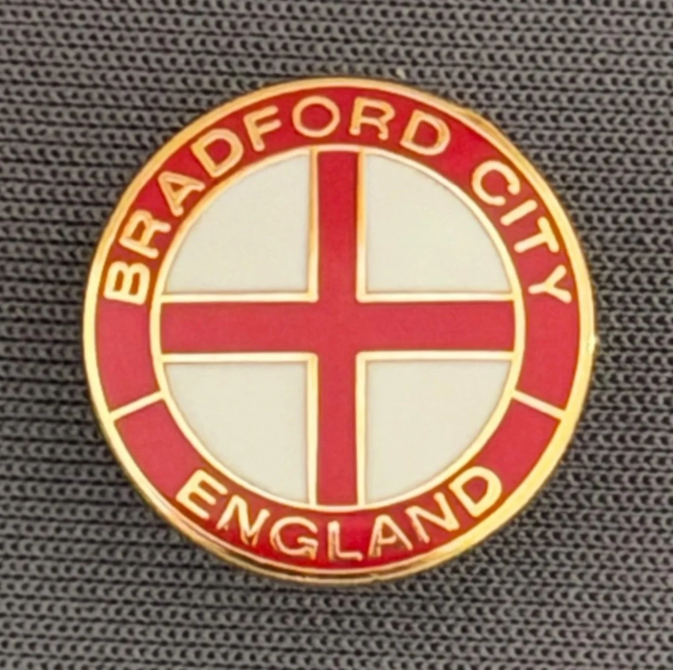 Reference Number: BCFLA023
Size: D 15.3 mm
Pin Type: Metal Clutch
Plating: Gold
Value: £6
Manufacturer: Andy Stokes
Comments: Circular St George Cross, Bradford City, England, Red