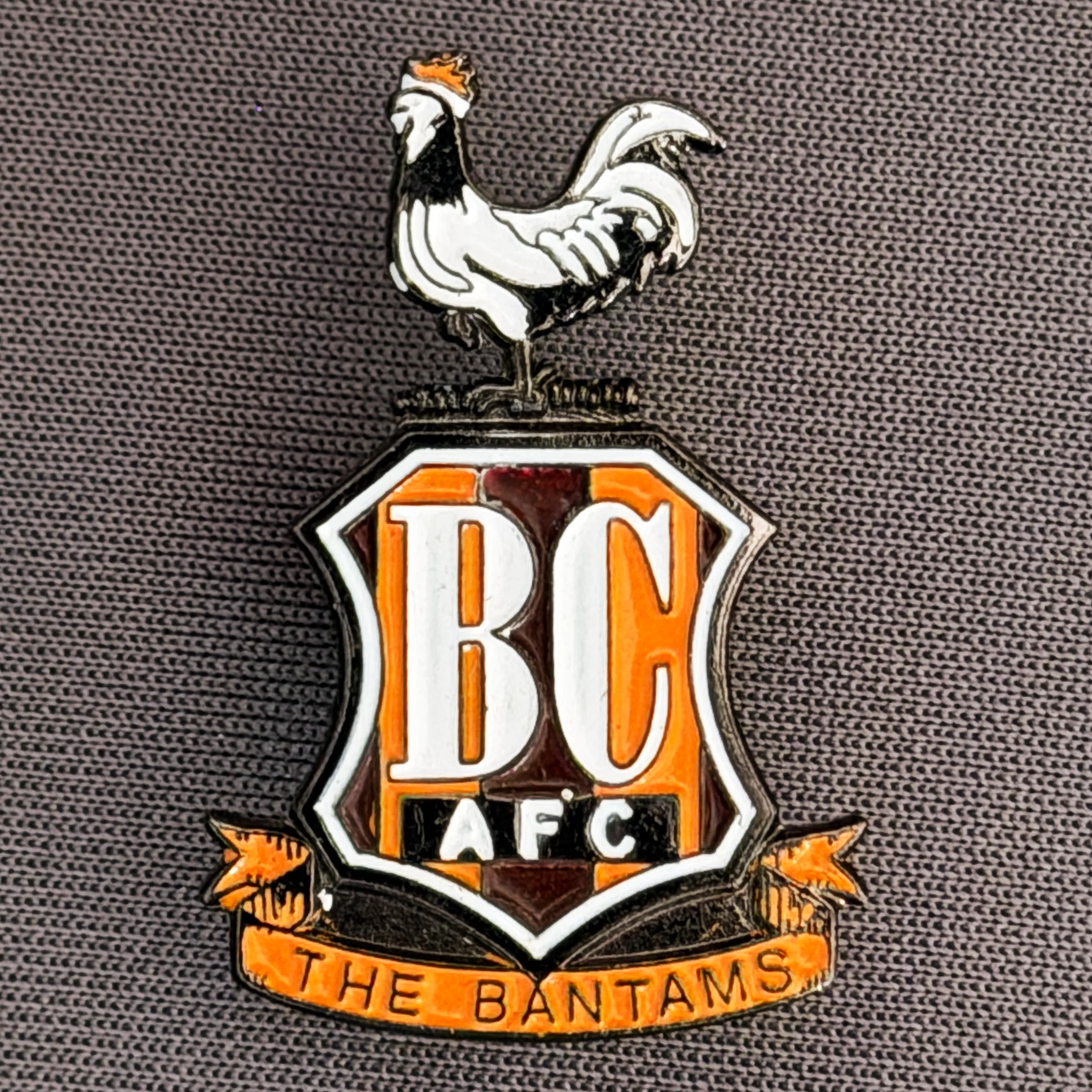 Reference Number: BCC&L073
Size: H 29.5 mm x 20  mm
Pin Type: Metal Clutch
Plating: Black Nickel
Value: £8
Manufacturer: Unknown
Comments: Classic BCAFC Logo