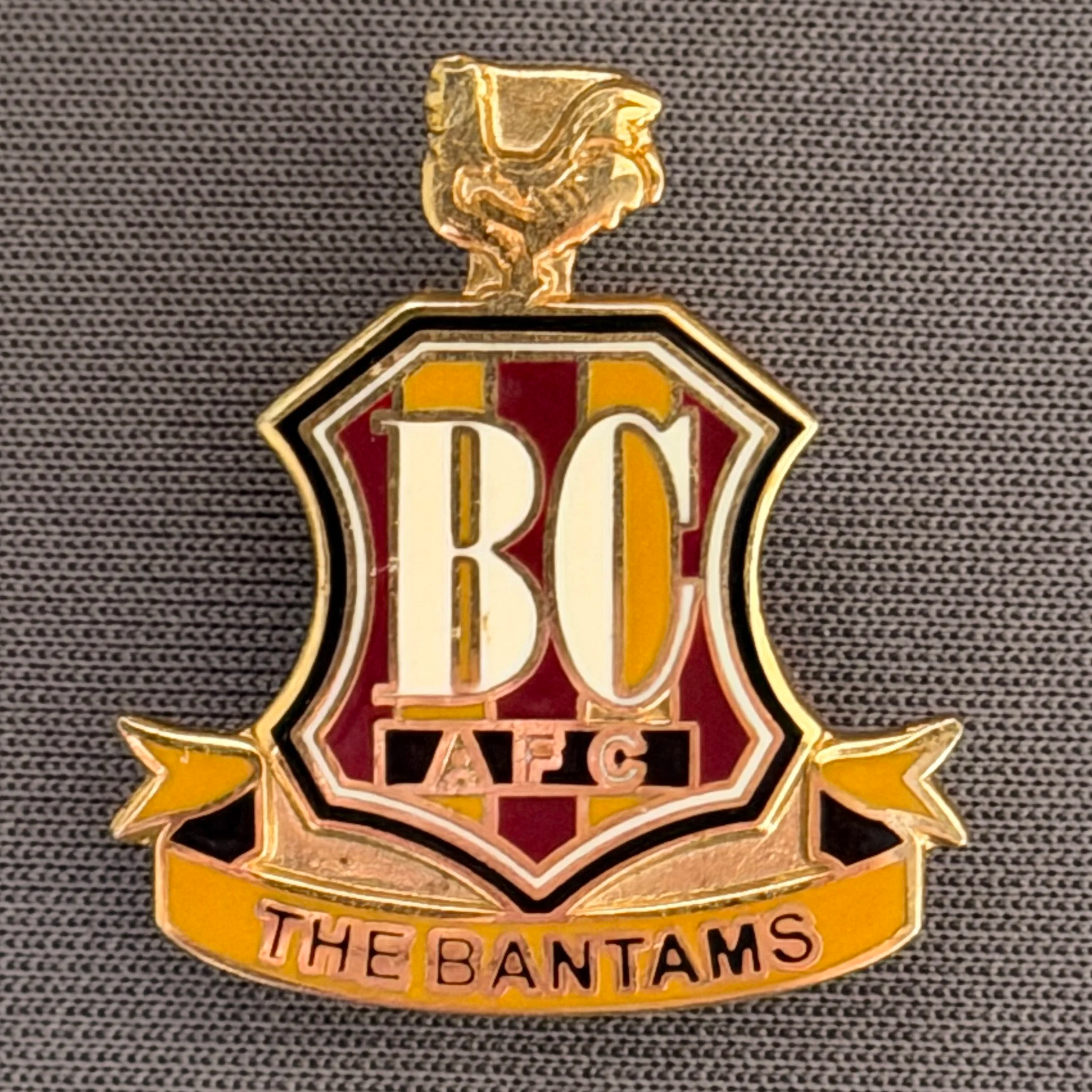 Reference Number: BCC&L077
Size: H 21.8 mm x 22.3  mm
Pin Type: Brooch Pin
Plating: Gold
Value: £8
Manufacturer: Unknown
Comments: Classic BCAFC Logo