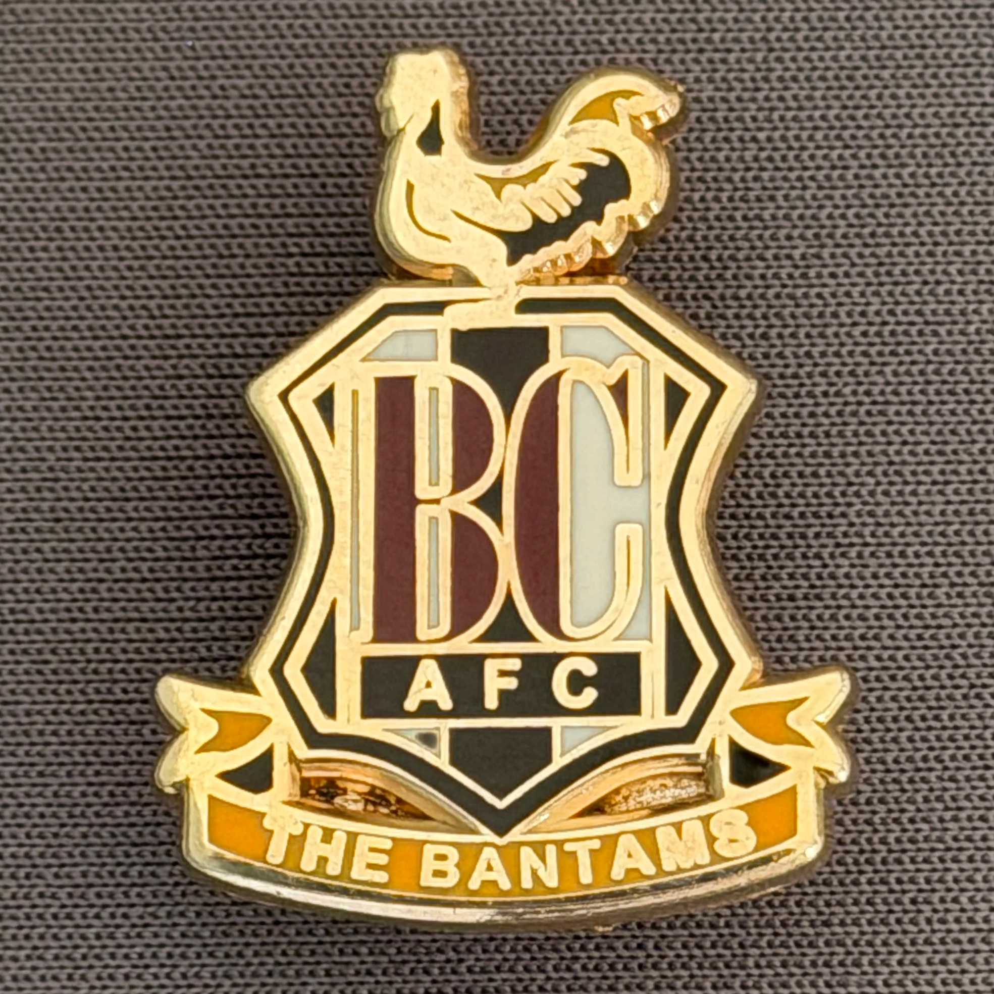 Reference Number: BCC&L084
Size: H 25.2 mm x 19.8  mm
Pin Type: Brooch Pin
Plating: Gold
Value: £8
Manufacturer: Unknown
Comments: Classic BCAFC Logo Variation