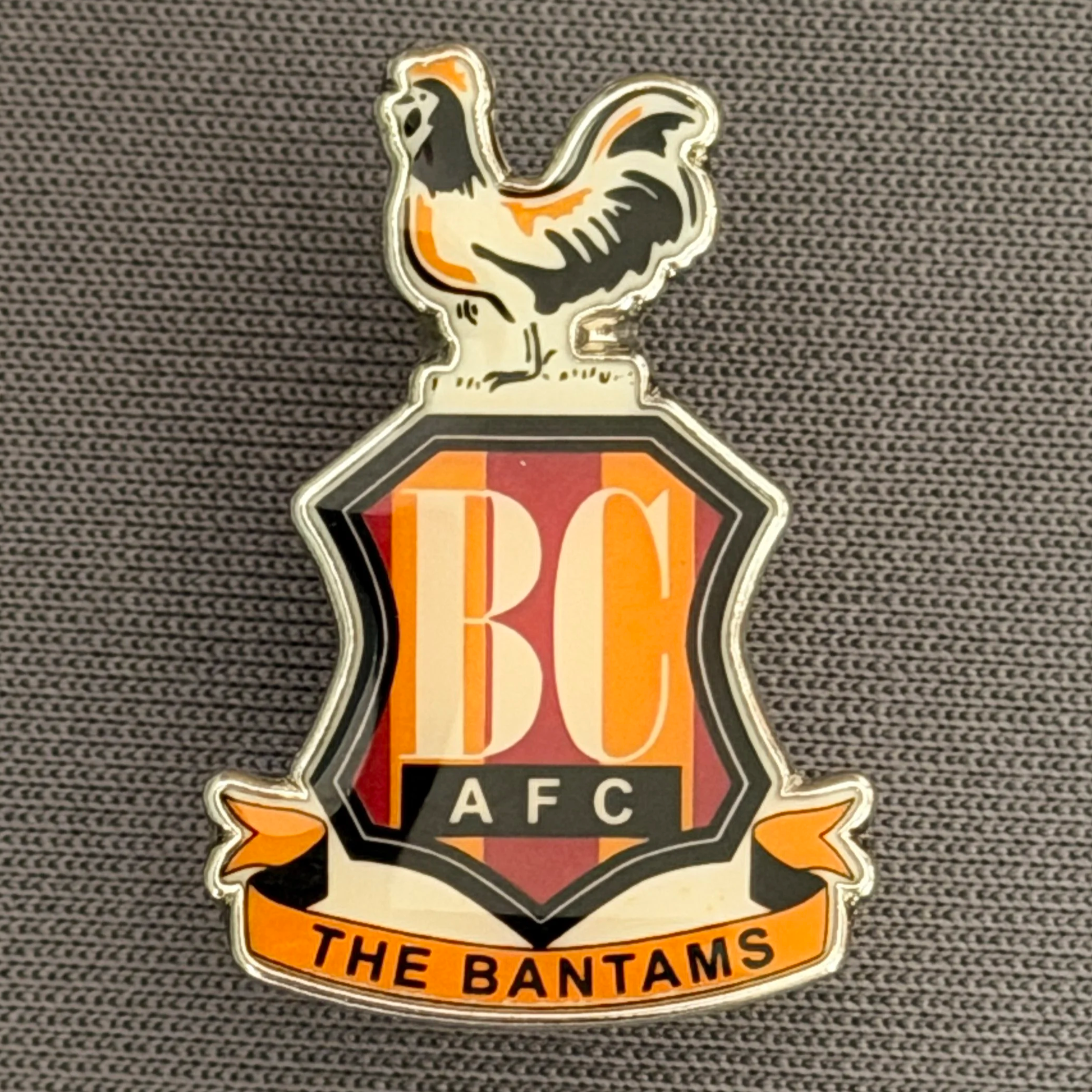 Reference Number: BCC&L089
Size: H 25.2 mm x 17.3  mm
Pin Type: Metal Clutch
Plating: Silver
Value: £8
Manufacturer: Unknown
Comments: Classic BCAFC Logo