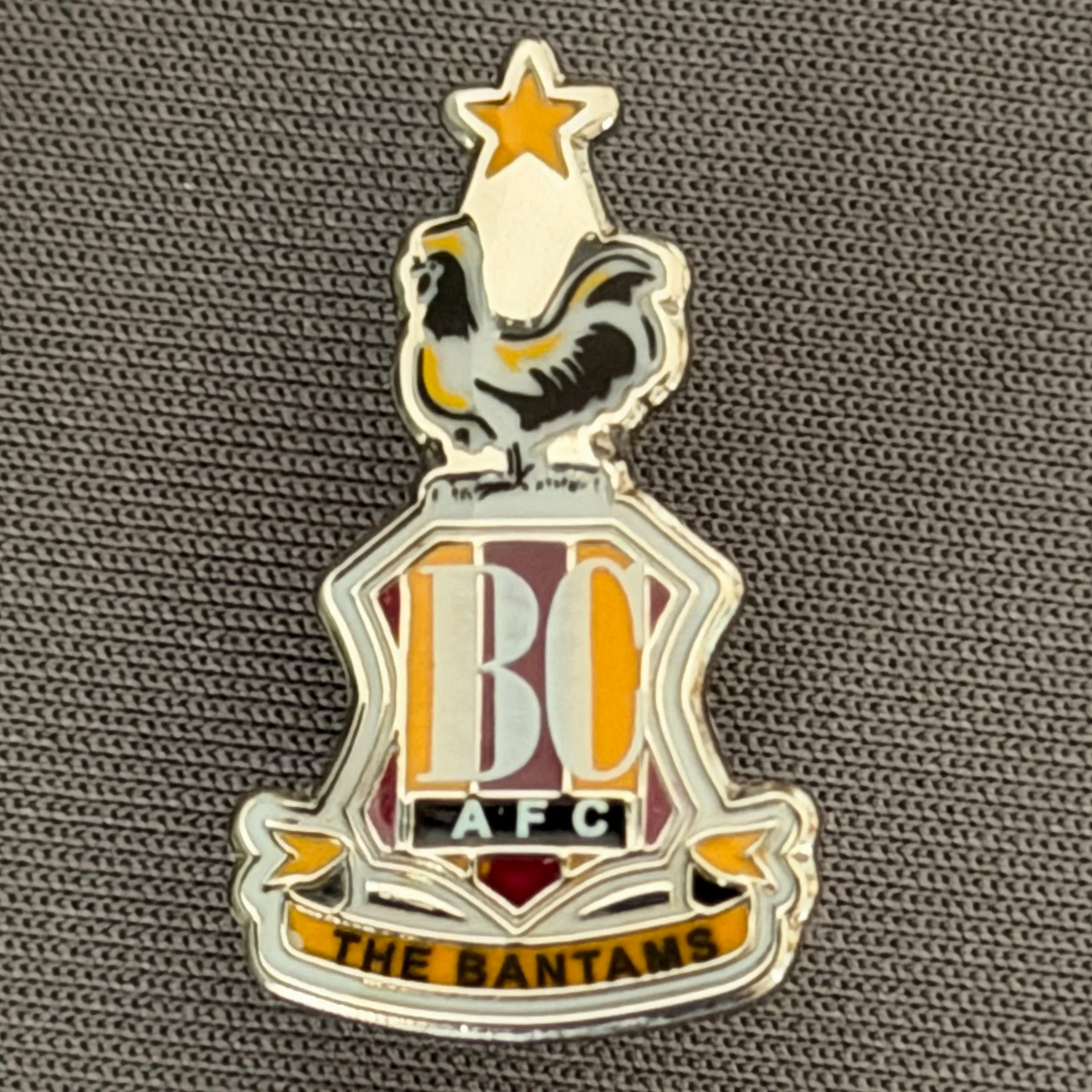 Reference Number: BCC&L90
Size: H 24.6 mm x 14.4  mm
Pin Type: Metal Clutch
Plating: Chrome
Value: £8
Manufacturer: Unknown
Comments: Classic BCAFC Logo