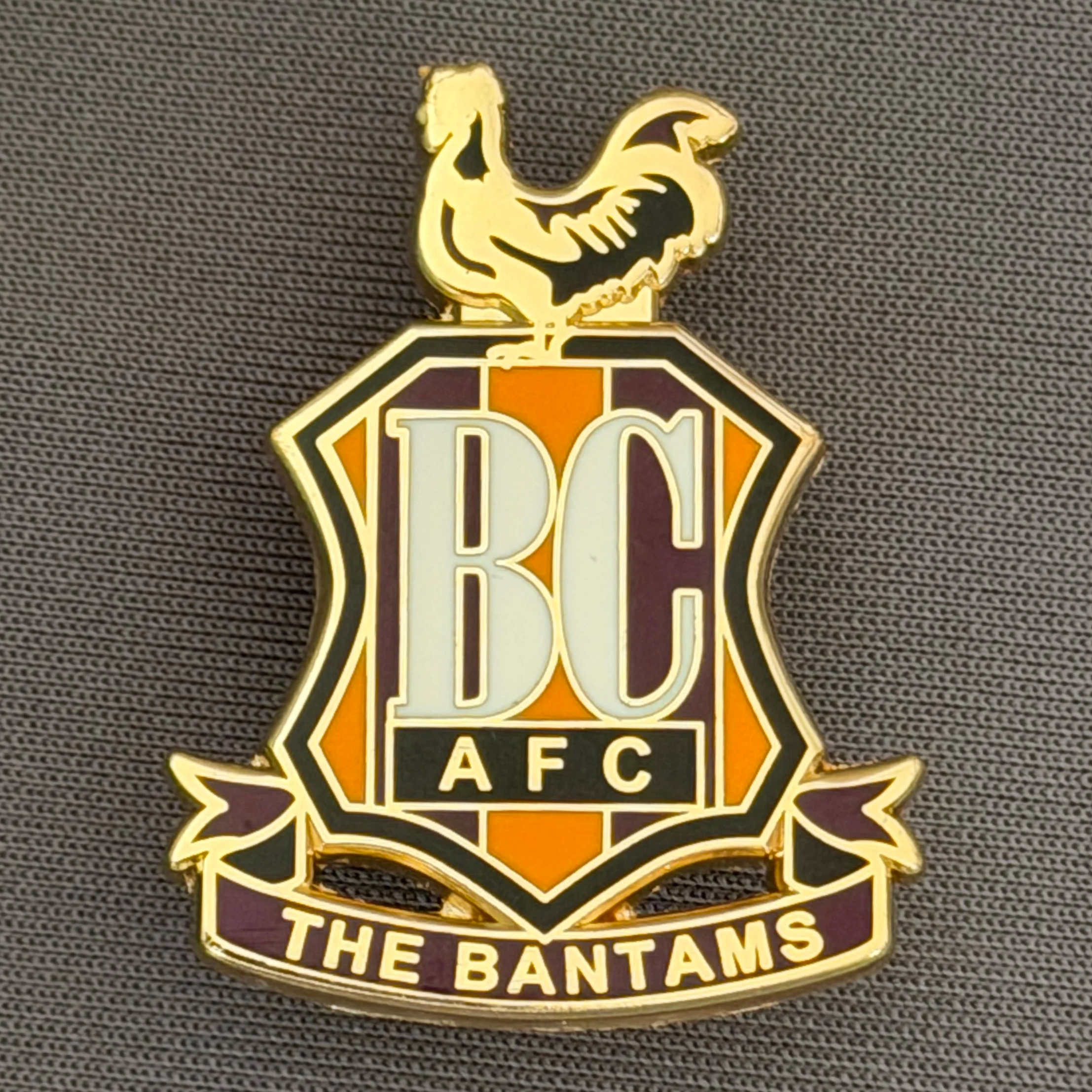 Reference Number: BCC&L092
Size: H 32.9 mm x 25.5  mm
Pin Type: Brooch Pin
Plating: Gold
Value: £6
Manufacturer: Unknown
Comments: Classic BCAFC Logo