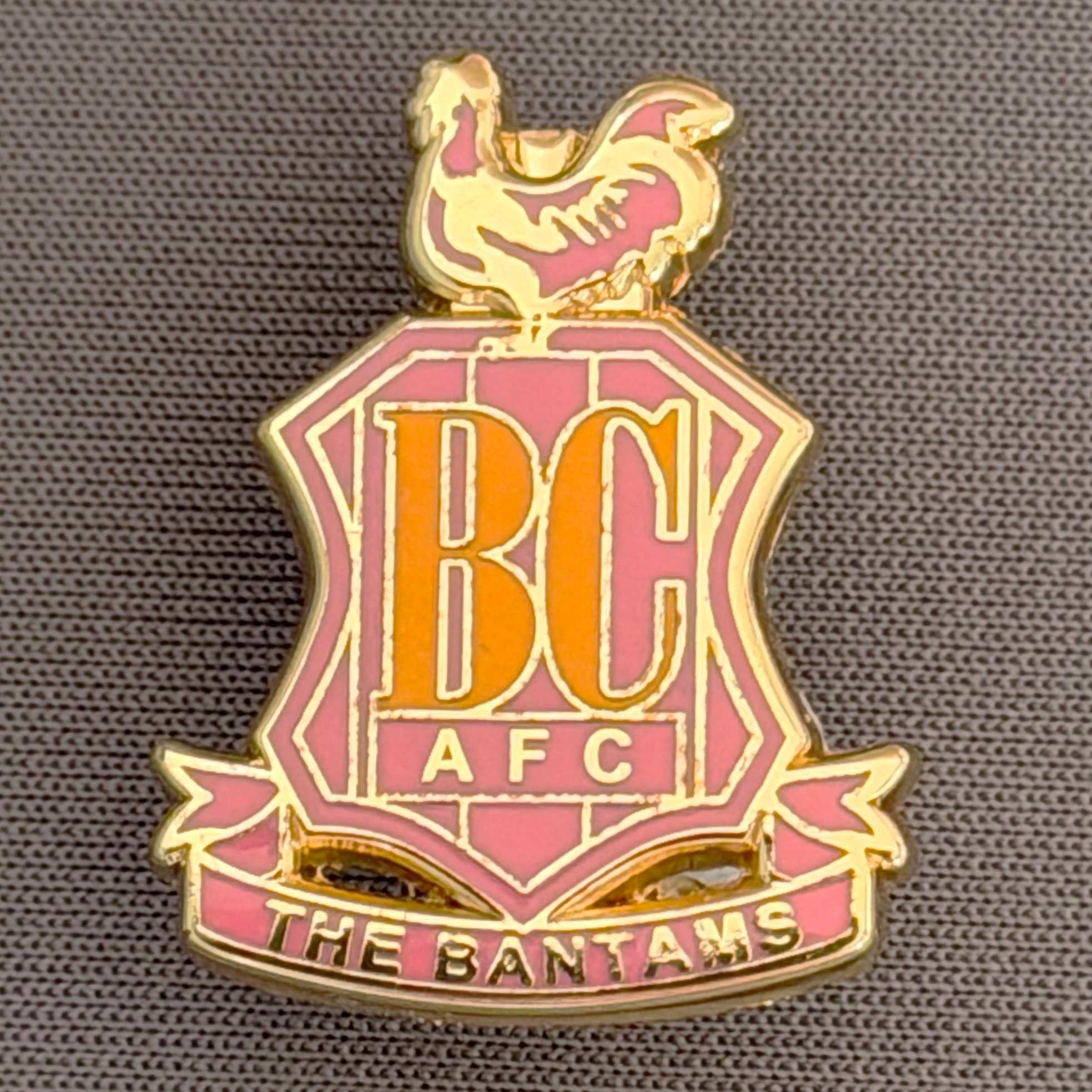 Reference Number: BCC&L097
Size: H 24.9 mm x 19.4  mm
Pin Type: Brooch Pin
Plating: Gold
Value: £6
Manufacturer: Unknown
Comments: Classic BCAFC Logo Small Pink Variant