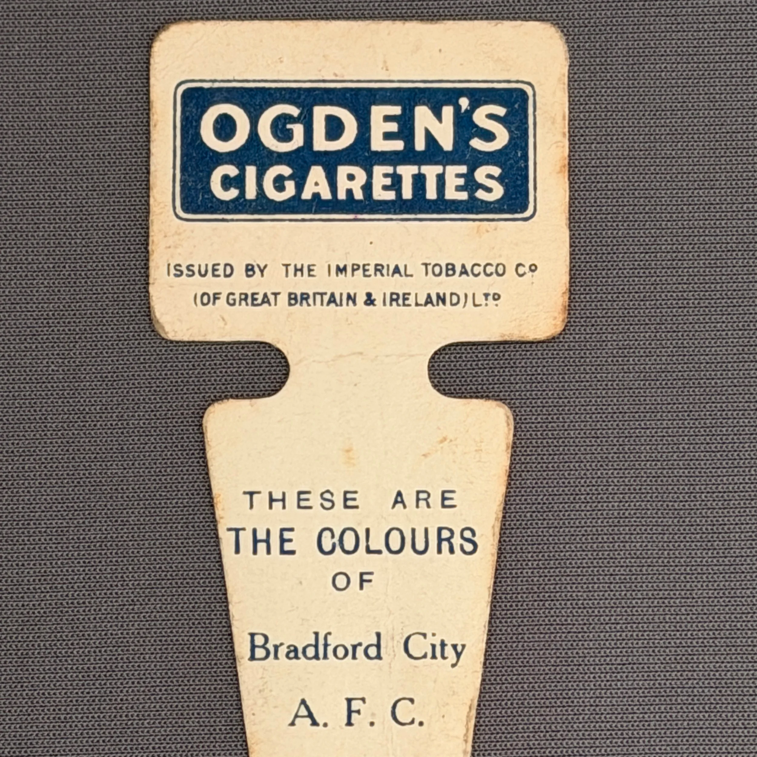 Reference Number: BCBCFC001
Size: H 62.7 mm x W 32.1 mm
Pin Type: Card
Plating: Cardboard
Value: £20
Manufacturer: Ogden's Cigarettes
Comments: Ogden's Cigarettes Button Hole Bradford City Badge. Dating from about 1910.
Rear View.