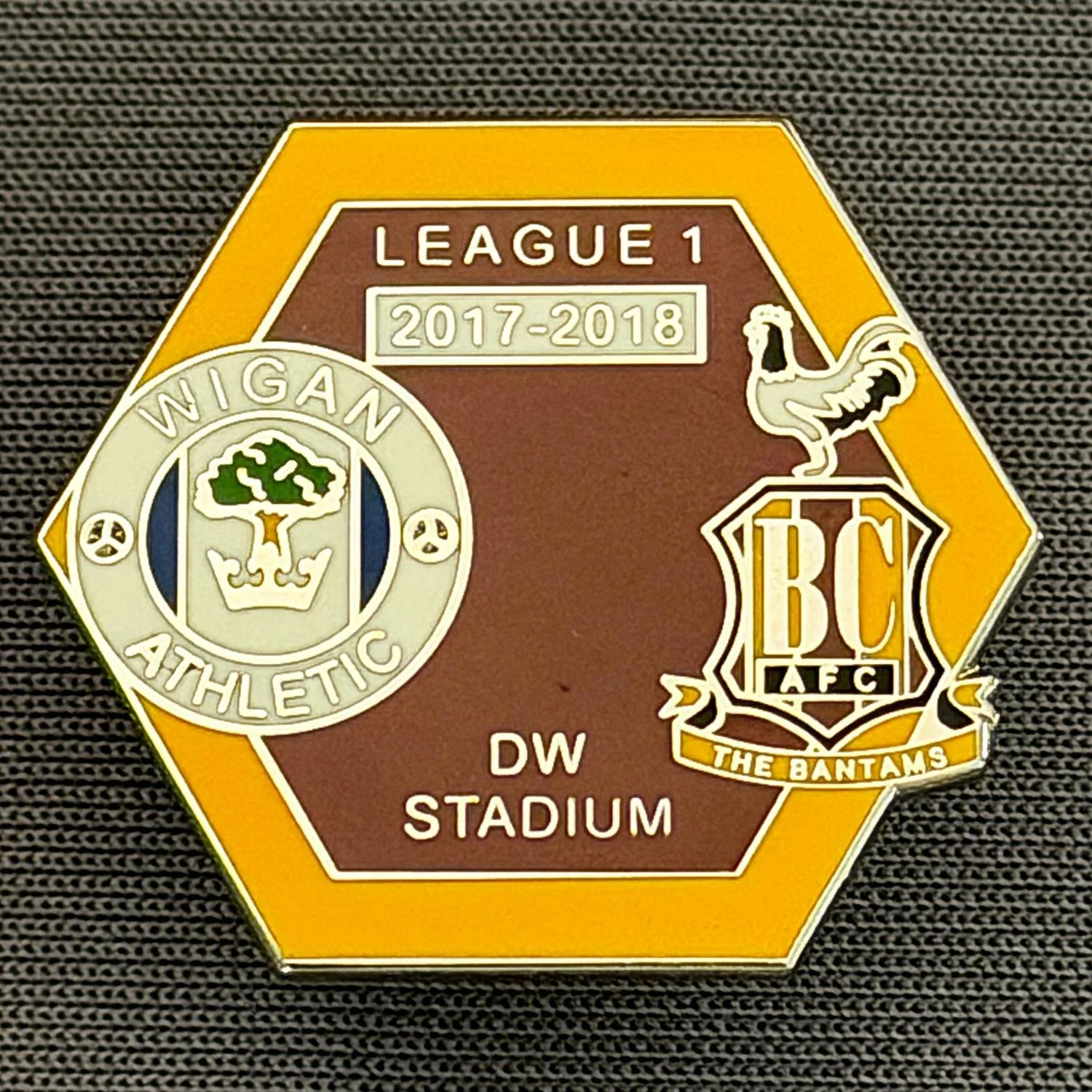 Reference Number: BCOFIX120
Size: H 21.6 mm x W 24.8 mm
Pin Type: Metal Clutch
Plating: Silver
Value: £5
Manufacturer: Unknown
Comments: Wigan v Bradford City, League One 2017/18, Claret & Amber Version 