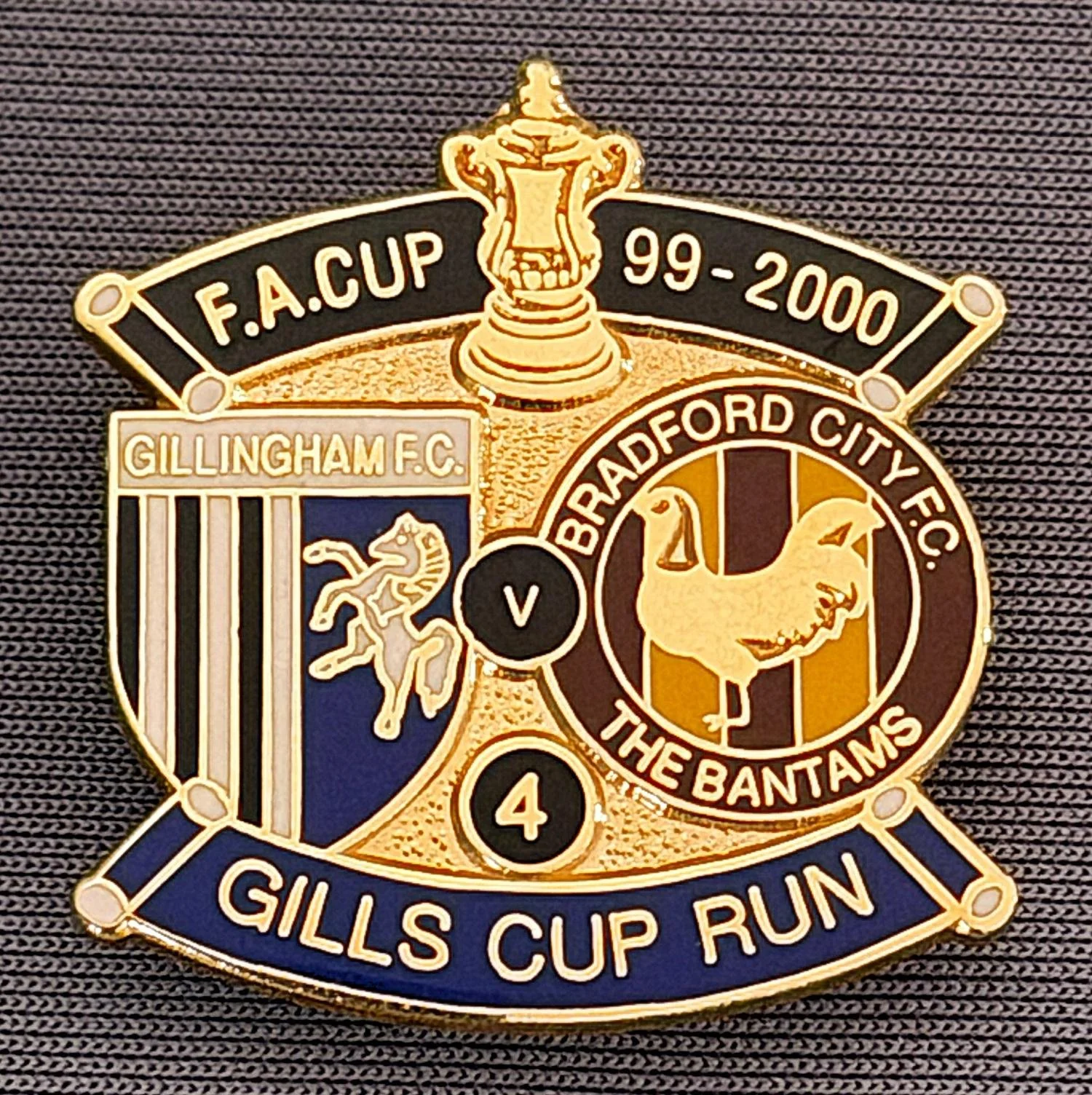 Reference Number: BCFAC050
Size: H 29 mm x W 27.3 mm
Pin Type: Brooch Pin
Plating: Gold
Value: £8
Manufacturer: Steve Skinner
Comments: F.A. Cup 1999-2000 Away v Gillingham