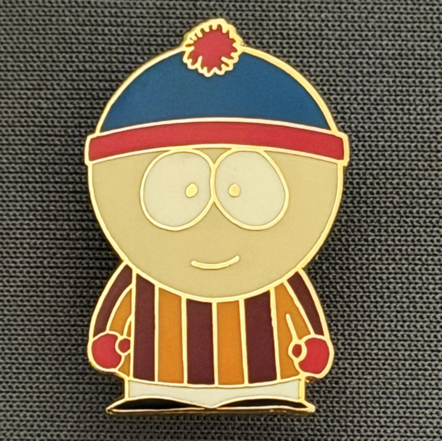 Reference Number: BCCTN013
Size: H 24.8 mm x W 16.3 mm
Pin Type: Brooch Pin
Plating: Gold
Value: £6
Manufacturer: Not Known
Comments: Stan Marsh South Park in Bradford City Kit