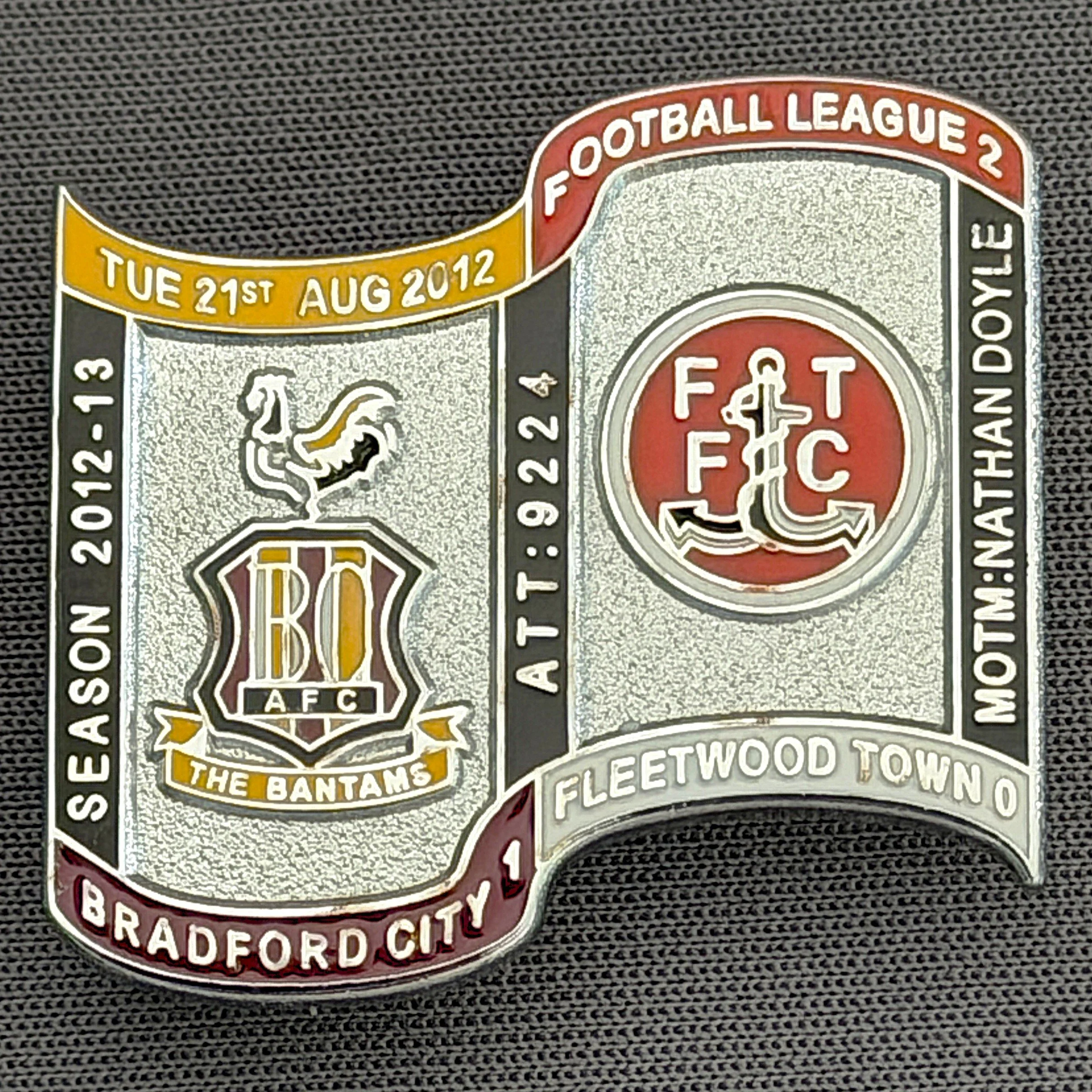 Reference Number: BCFIX139
Size: H 26.9 mm x W 29.2 mm
Pin Type: Brooch Pin
Plating: Chrome
Value: £10
Manufacturer: Bradford City Badges
Comments: Bradford City v Fleetwood Town Town  2012/13 Limited Edition 10 Badges (Silver Version)