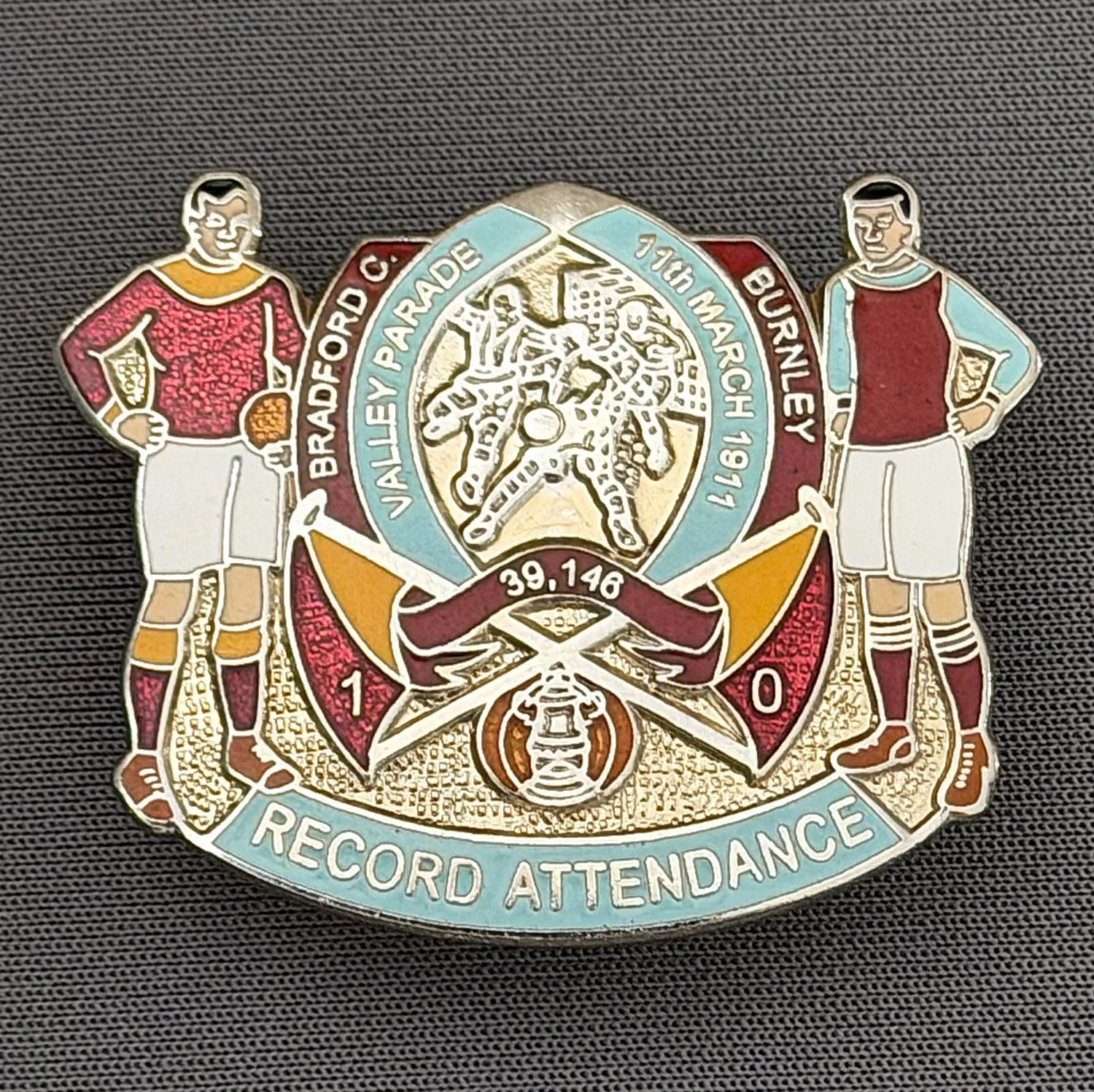 Reference Number: BCEVE031
Size: H 30.9 mm x W 38.1 mm
Pin Type: Double Metal Clutch
Plating: Platinum
Value: £20
Manufacturer: AKP Designs
Comments: Record Attendance, Blue & Claret Version