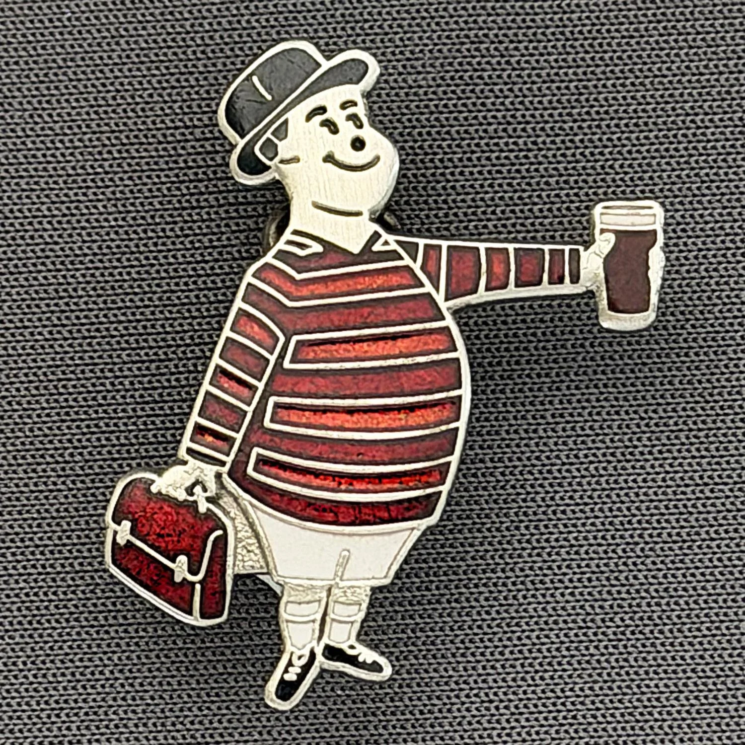 Reference Number: BCGEN061
Size: H 28.8 mm x W 20.9 mm
Pin Type: Brooch Pin
Plating: Antique Silver
Value: £20
Manufacturer: Bradford City Badges
Comments: City Gent Beer Cloisonne, Claret Briefcase. One Off Badge.