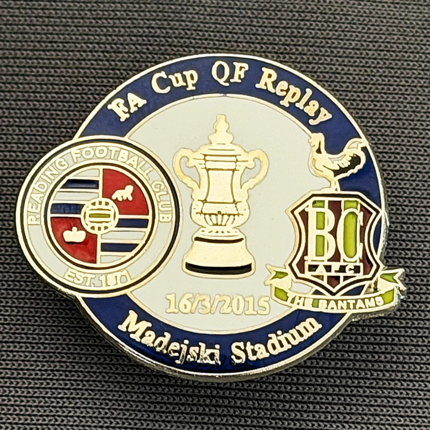Reference Number: BCFAC129
Size: H 21.9 mm x W 26 mm
Pin Type: Metal Clutch
Plating: Silver
Value: £4
Manufacturer: Dan Lloyd
Comments: F.A. Cup Quarter Final Replay 2014/15, Away v Reading, Blue & White Version