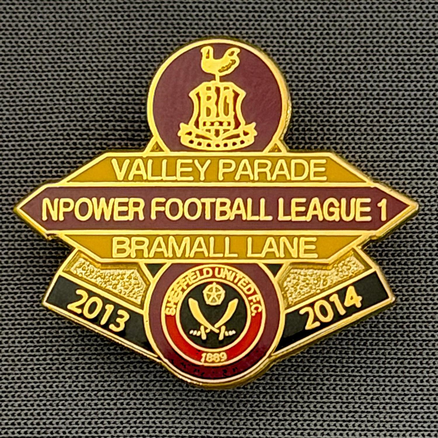 Reference Number: BCOFIX080
Size: H 22.5 mm x W 25.6 mm
Pin Type: Brooch Pin
Plating: Gold
Value: £5
Manufacturer: Unknown
Comments: Bradford City v Sheffield United, League One, Claret & Amber Version