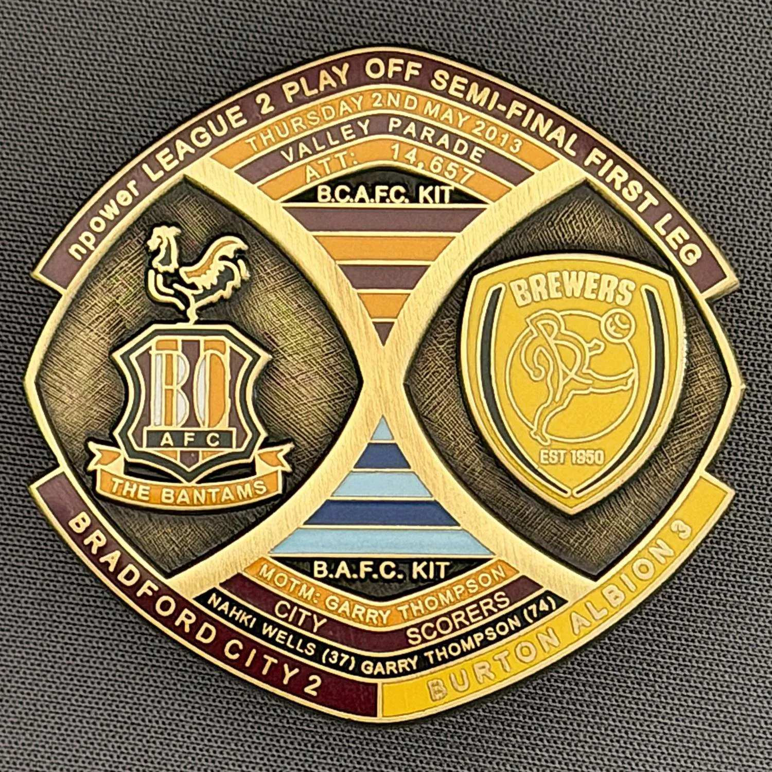 Reference Number: BCOFIX019
Size: H 40 mm x W 42.1 mm
Pin Type: Brooch Pin
Plating: Antique Brass
Value: £15
Manufacturer: Bradford City Badges
Comments: League 2 Semi Final Play Off 1st Leg v Burton Albion 2013, Limited Edition 1