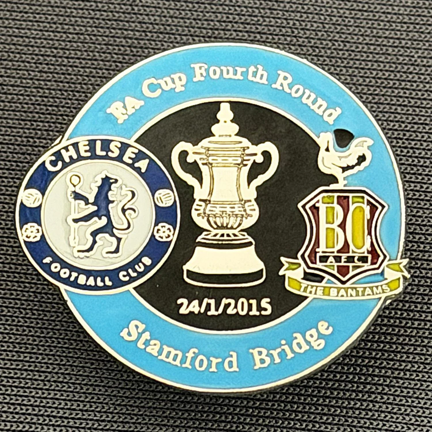Reference Number: BCFAC095
Size: H 23.3 mm x W 25.3 mm
Pin Type: Metal Clutch
Plating: Silver
Value: £4
Manufacturer: Dan Lloyd
Comments: F.A. Cup Fourth Round 2014/15, Away v Chelsea, Royal Blue & Black Version