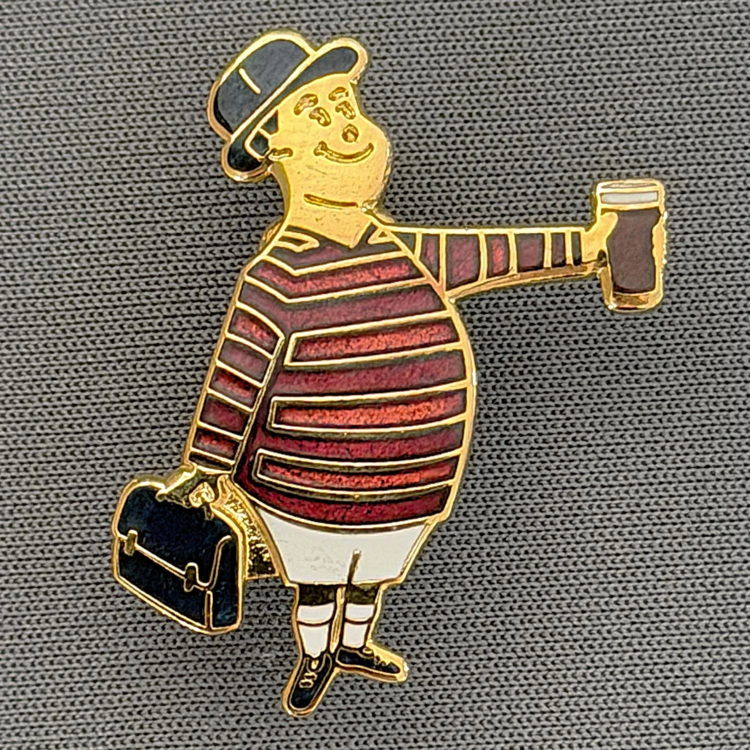 Reference Number: BCGEN053
Size: H 28.8 mm x W 20.9 mm
Pin Type: Brooch Pin
Plating: Gold
Value: £15
Manufacturer: Bradford City Badges
Comments: City Gent Beer Cloisonne, Black Briefcase. Limited Edition Set of 15.