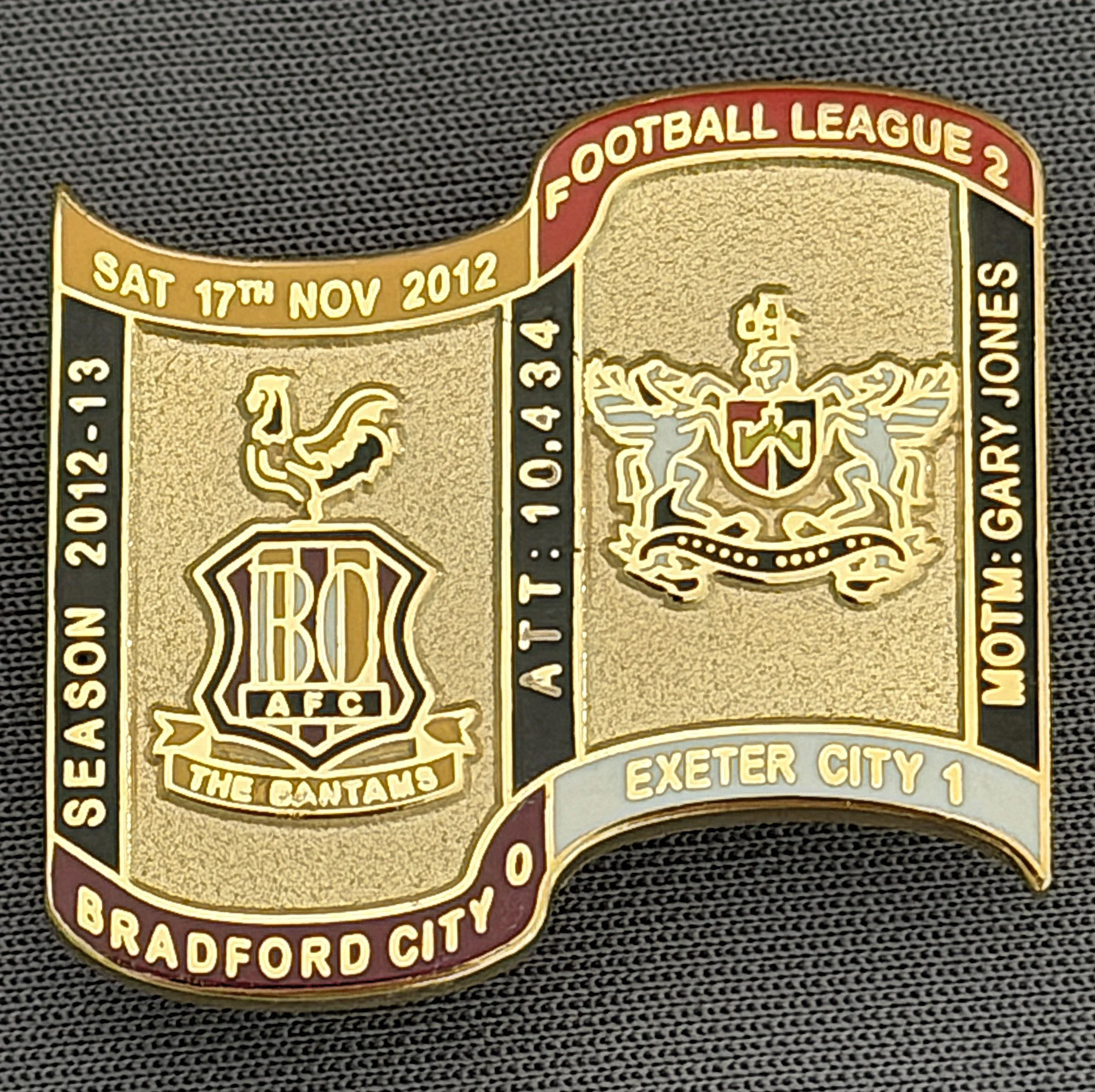 Reference Number: BCFIX124
Size: H 26.9 mm x W 29.2 mm
Pin Type: Brooch Pin
Plating: Gold
Value: £8
Manufacturer: Bradford City Badges
Comments: Bradford City v Exeter City 2012/13 Limited Edition 65 Badges