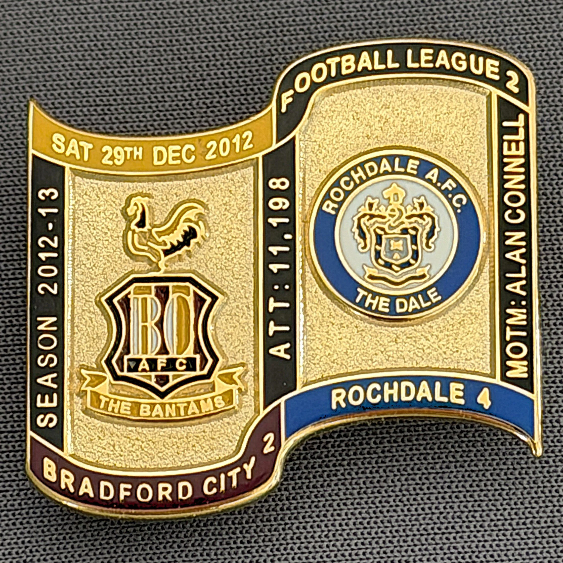 Reference Number: BCFIX128
Size: H 26.9 mm x W 29.2 mm
Pin Type: Brooch Pin
Plating: Gold
Value: £8
Manufacturer: Bradford City Badges
Comments: Bradford City v Rochdale 2012/13 Limited Edition 65 Badges