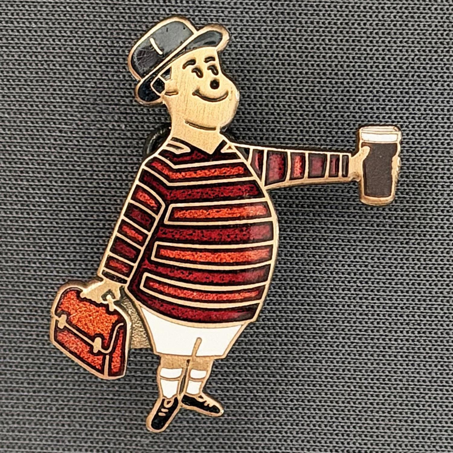 Reference Number: BCGEN095
Size: H 28.8 mm x W 20.9 mm
Pin Type: Brooch Pin
Plating: Antique Bronze
Value: £20
Manufacturer: Bradford City Badges
Comments: City Gent Beer Cloisonne, Amber Briefcase. One Off Badge.