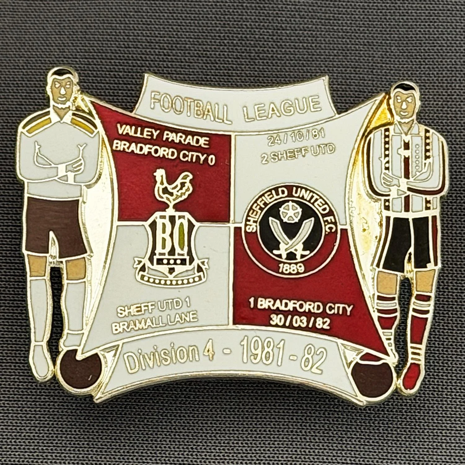 Reference Number: BCOFIX053
Size: H 30.1 mm x W 38 mm
Pin Type: Double Metal Clutch
Plating: Silver
Value: £8
Manufacturer: Unknown
Comments: Bradford City v Sheffield United 1981/82 Division 4, Red & White Version