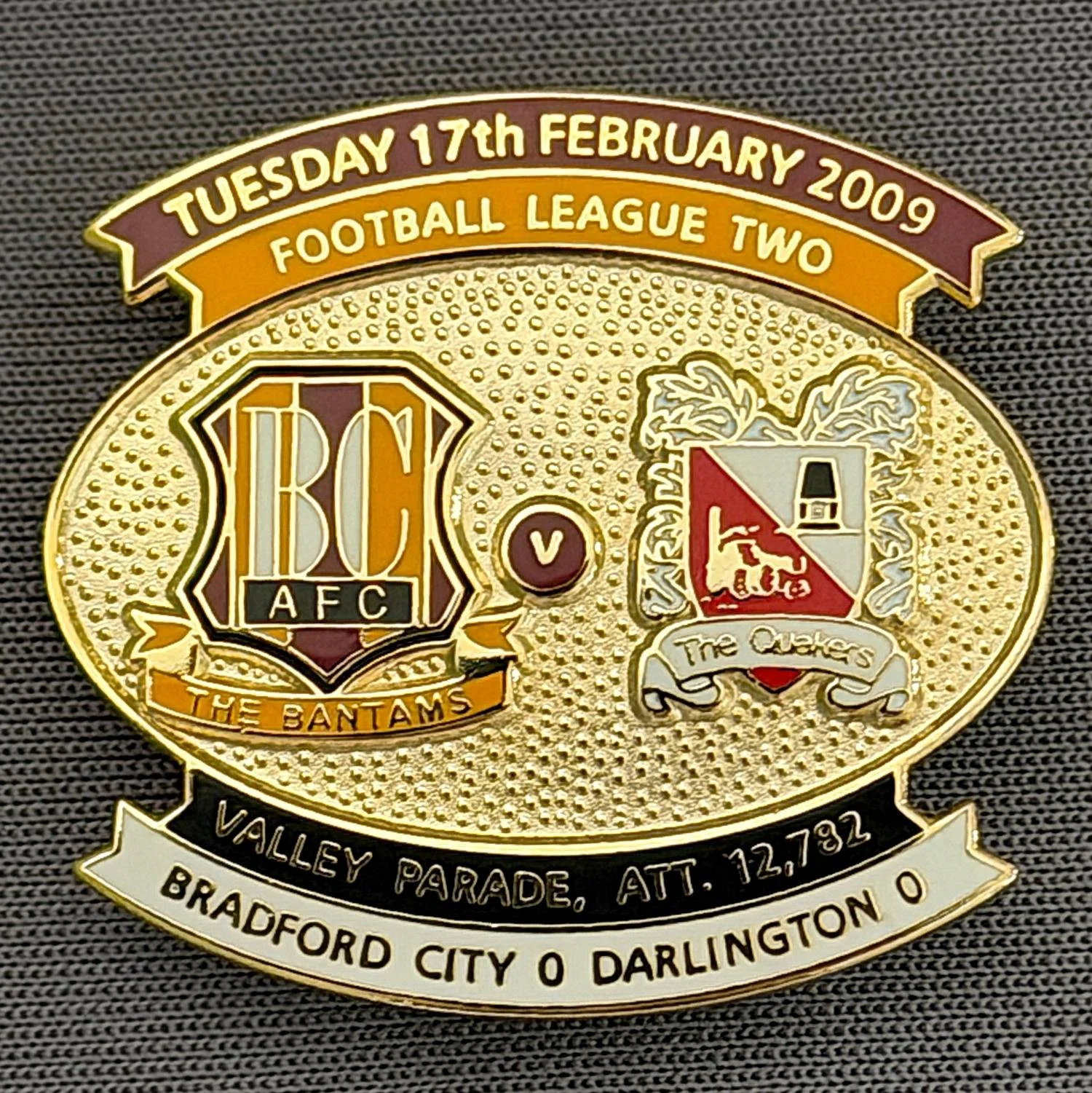 Reference Number: BCFIX017
Size: H 26.6 mm x W 29 mm
Pin Type: Brooch Pin
Plating: Gold
Value: £8
Manufacturer: Bradford City Badges
Comments: Bradford City v Darlington 2008/09 Limited Edition 100 Badges
